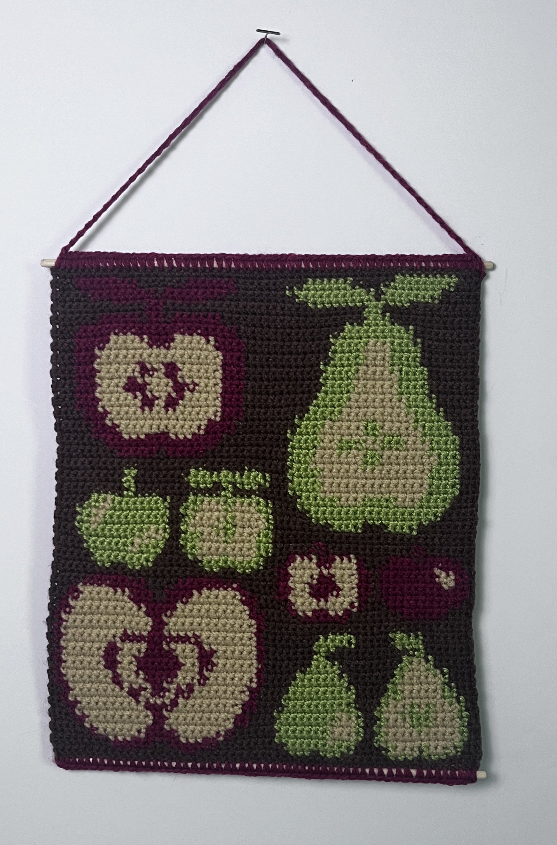 Apples and Pears, 12.5 x 10.75”, acrylic yarn, wooden dowels, felt,  2026