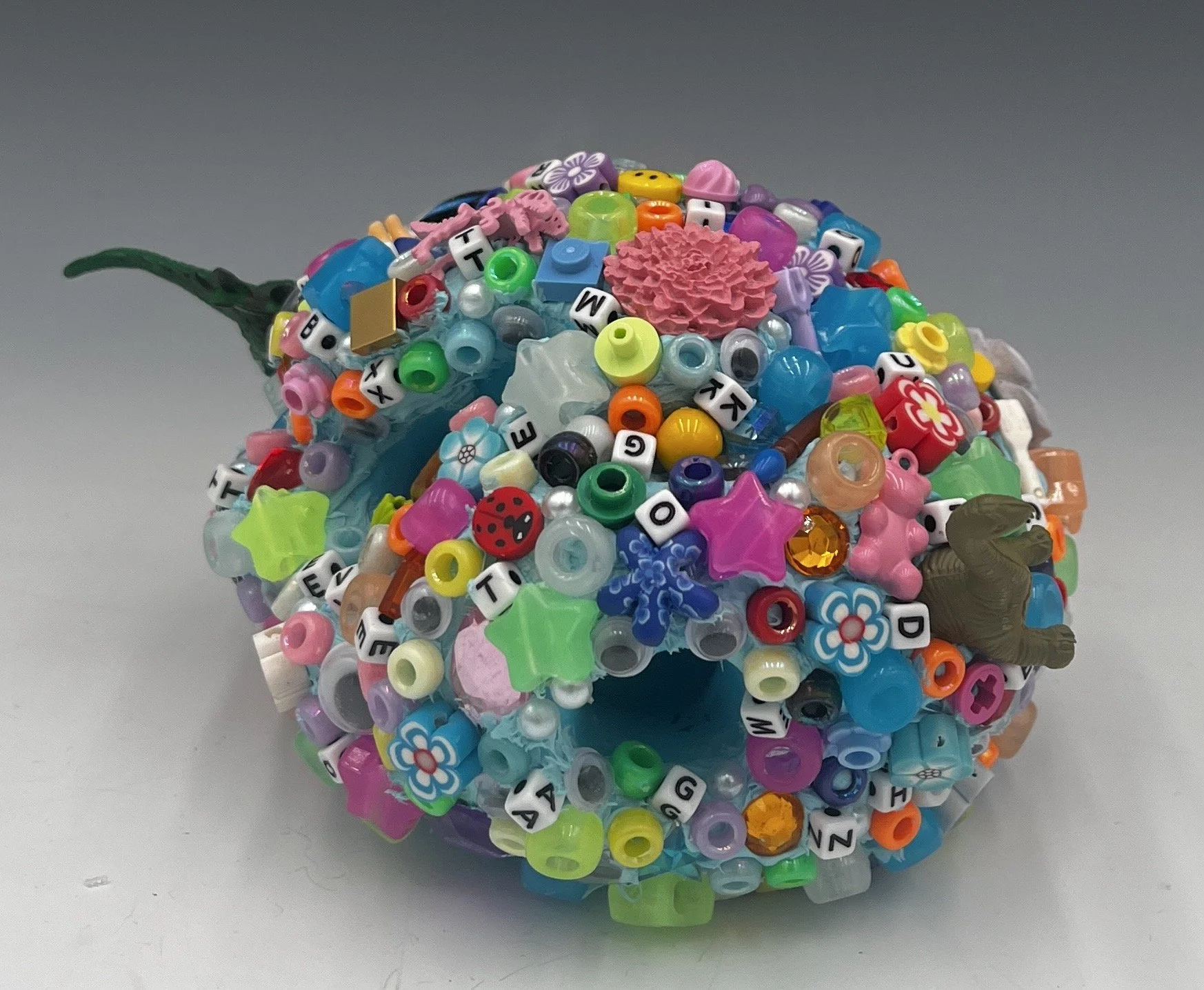 Glob #4, 3.5 x 7 x 4.5”, Ceramic, acrylic paint, found plastic objects, 2025