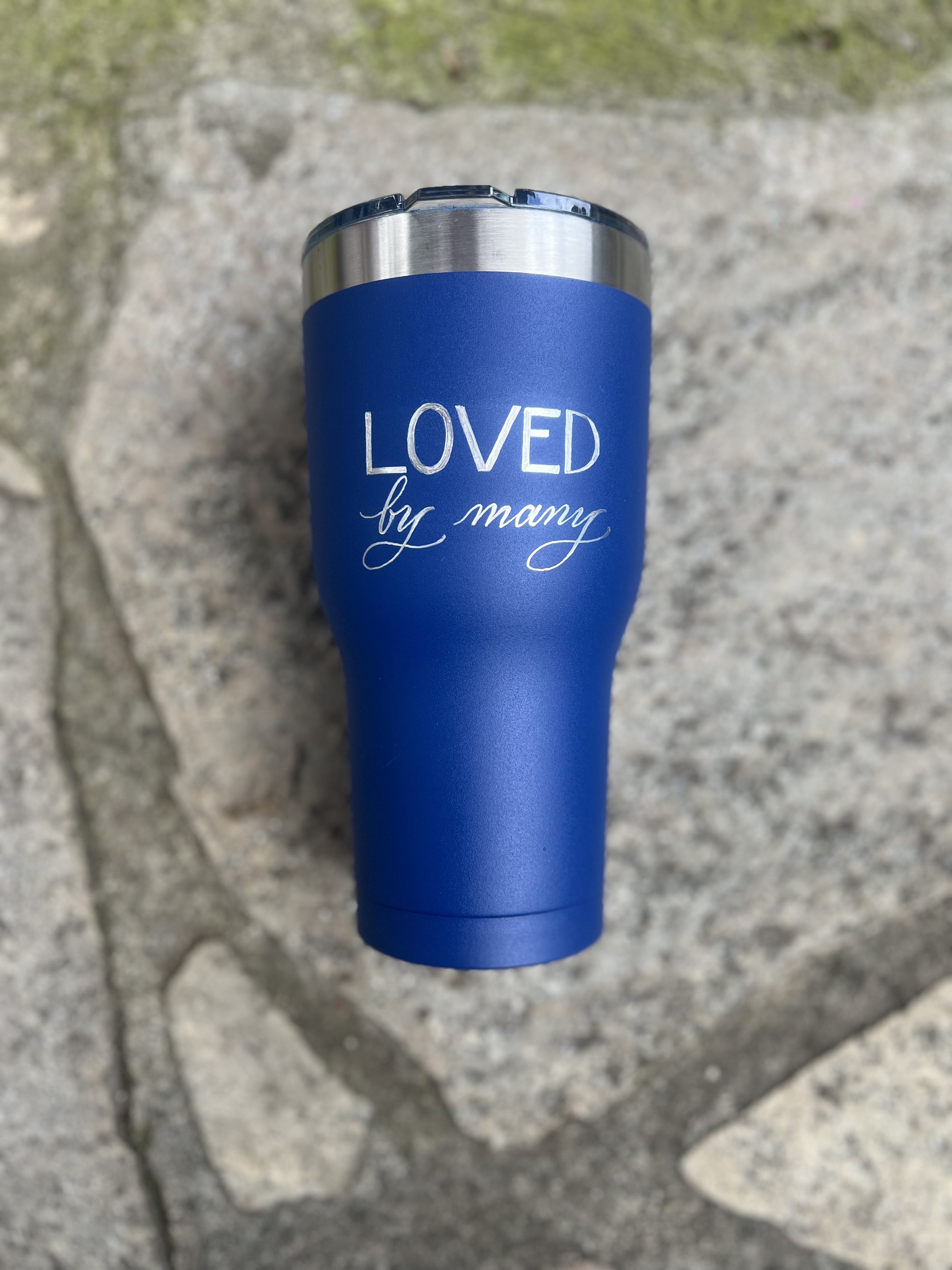 Custom engraved drinking cup with guest name created during a live event activation.