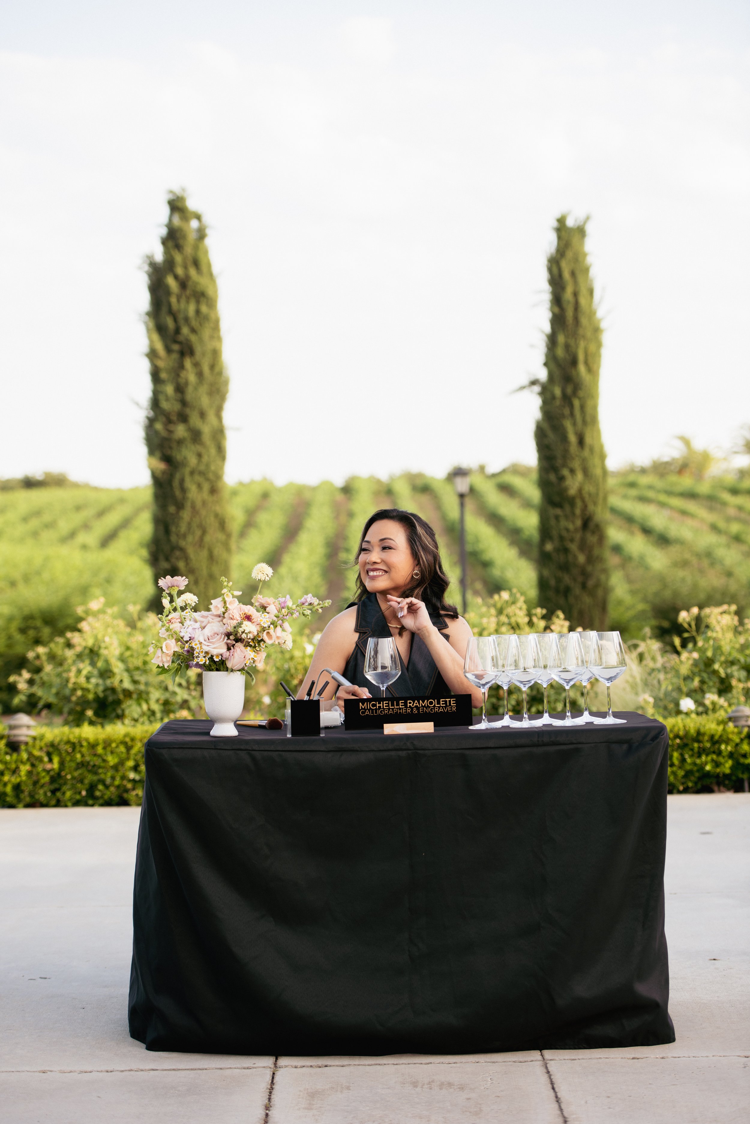 Michelle Ramolete engraving personalized gifts live at a California corporate event activation.