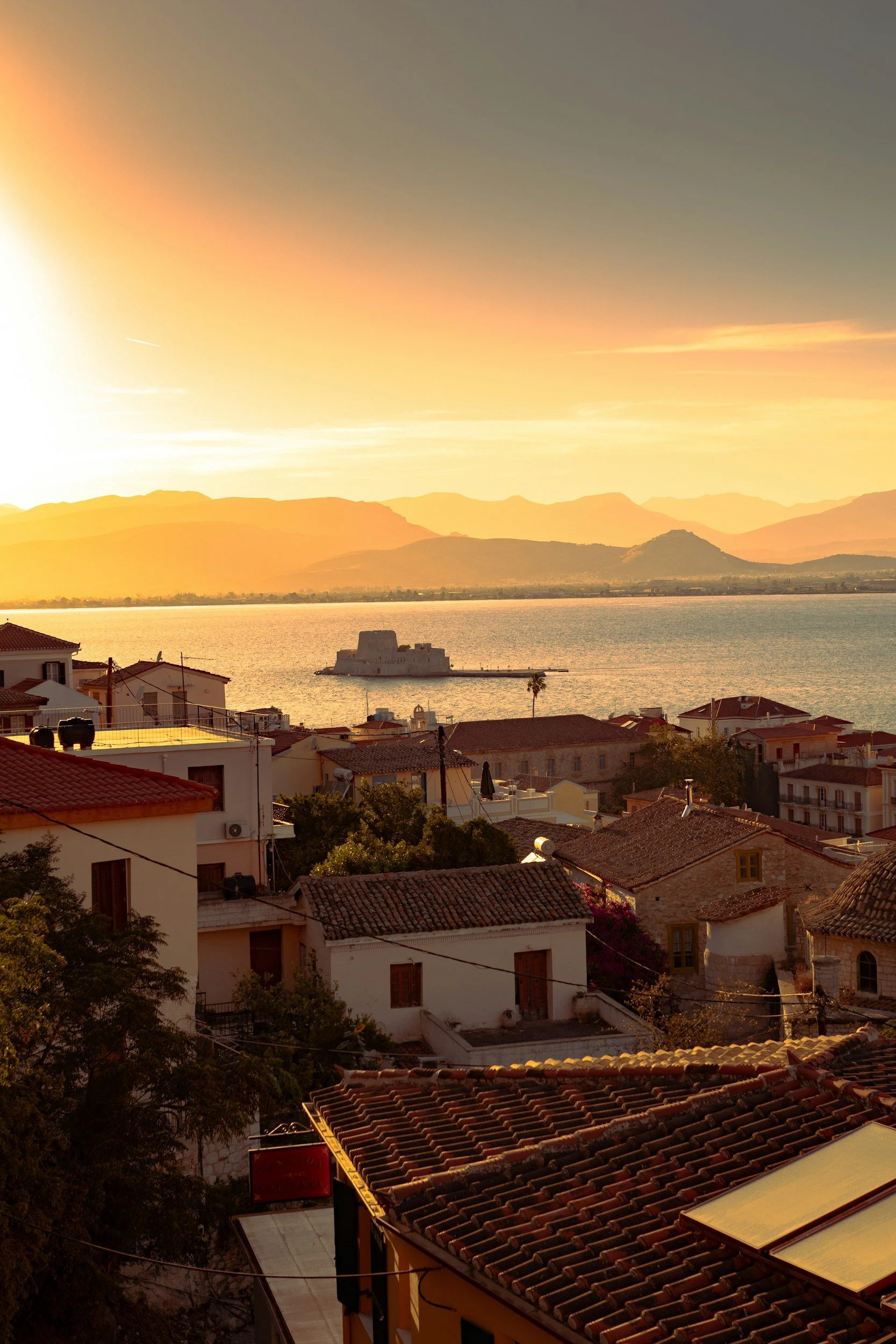 Sunset view over Nafplio old town and Bourtzi Castle in Greece
