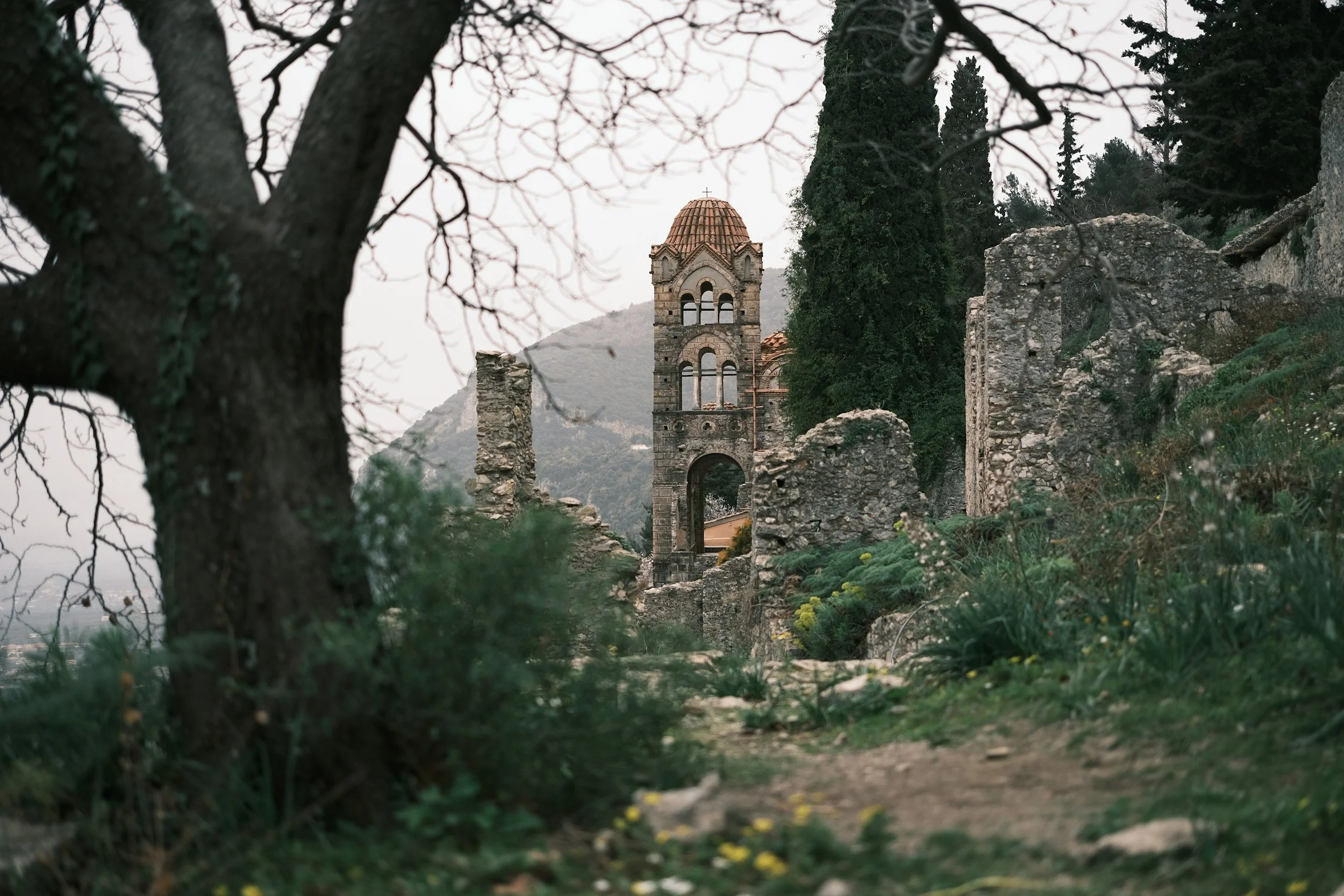 Medieval Byzantine church and stone pathways at Mystras UNESCO heritage site