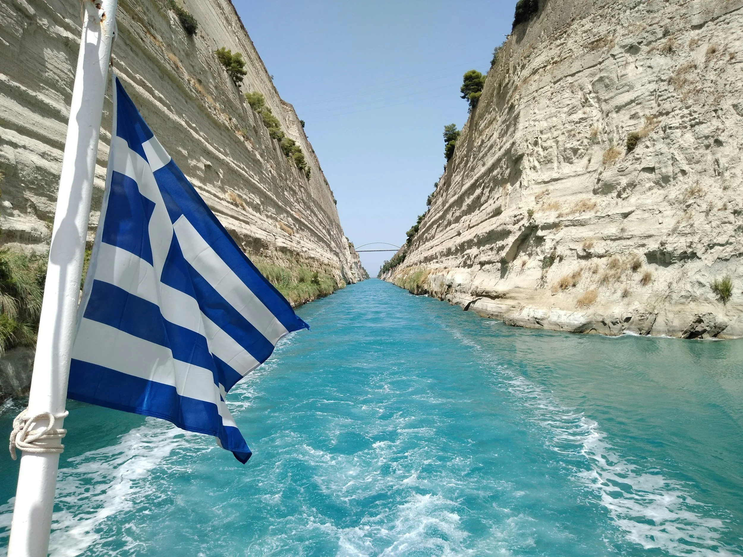 Greek flag overlooking the Corinth Canal in Greece