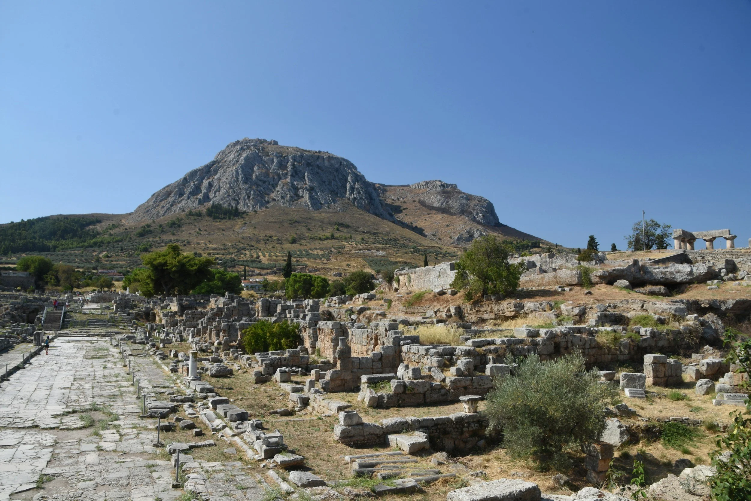 Archaeological ruins of Ancient Corinth with mountain landscape Greece