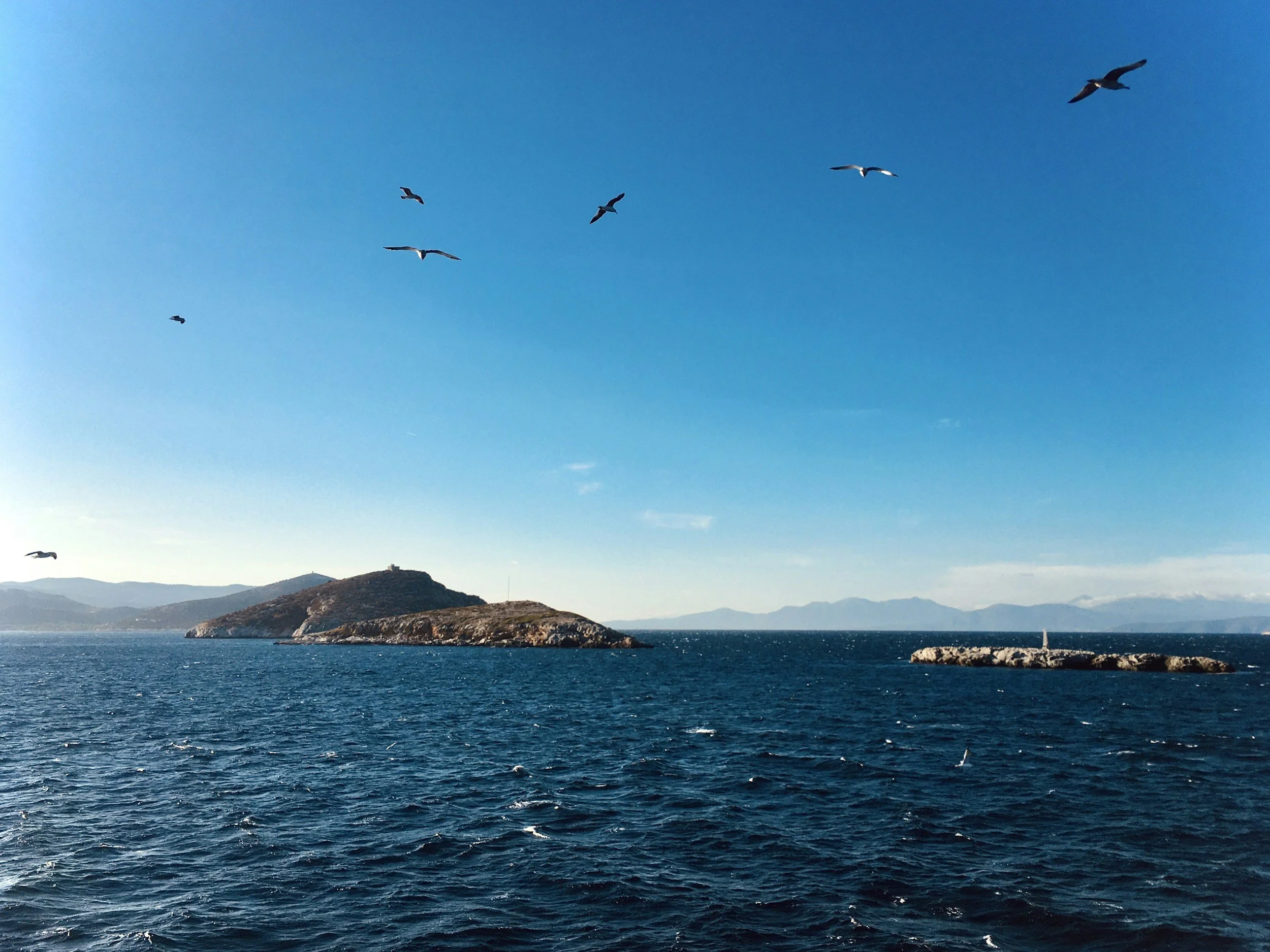 Sea view on the route to Evia Island with blue water and coastal landscape in Greece