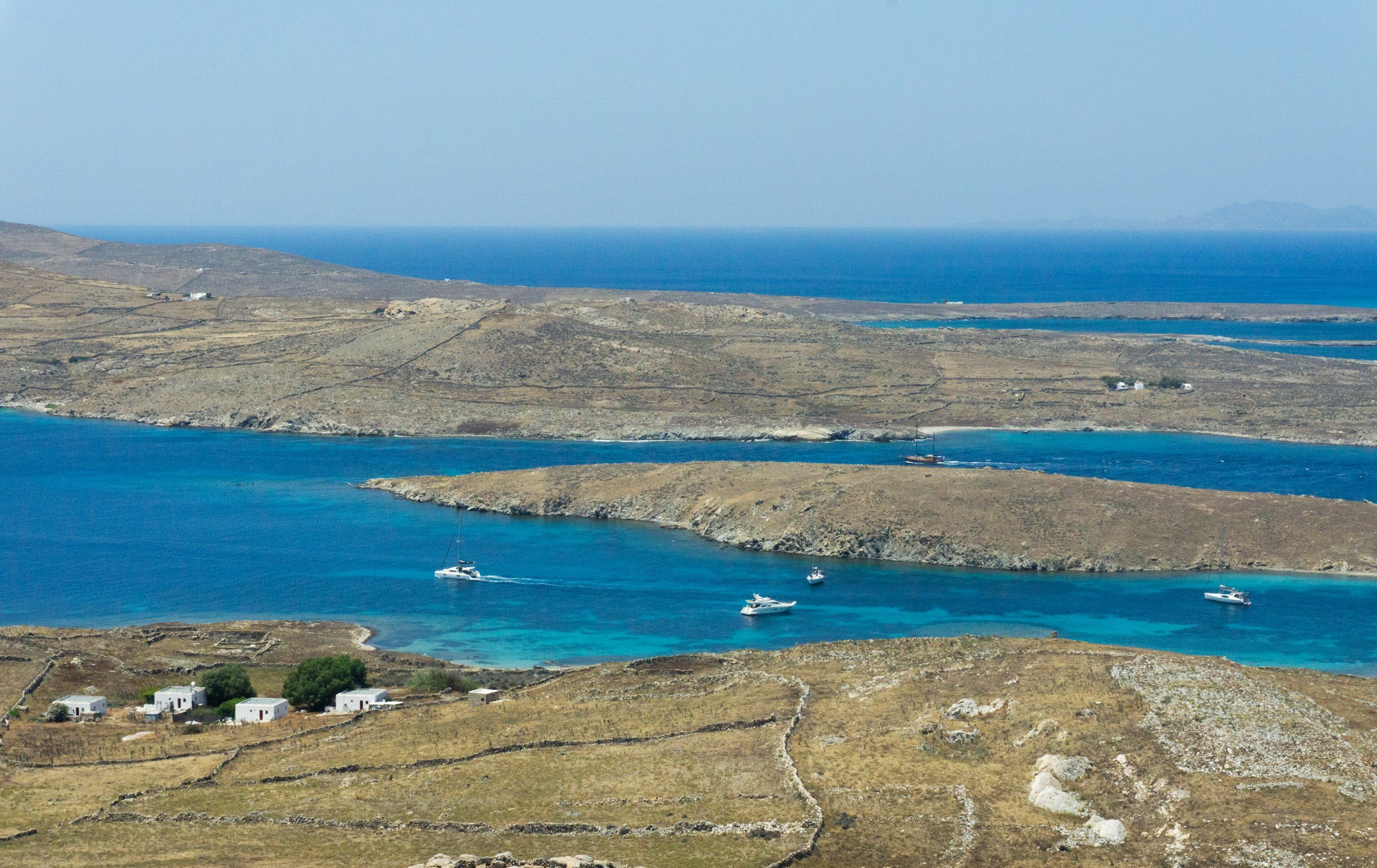 Sea view of Delos Island during a catamaran cruise from Mykonos