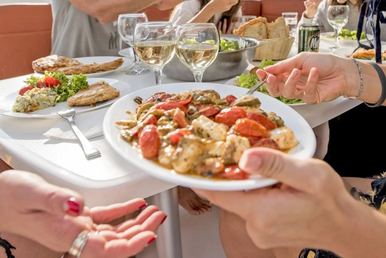 Fresh lunch and drinks served on board during a Mykonos catamaran cruise