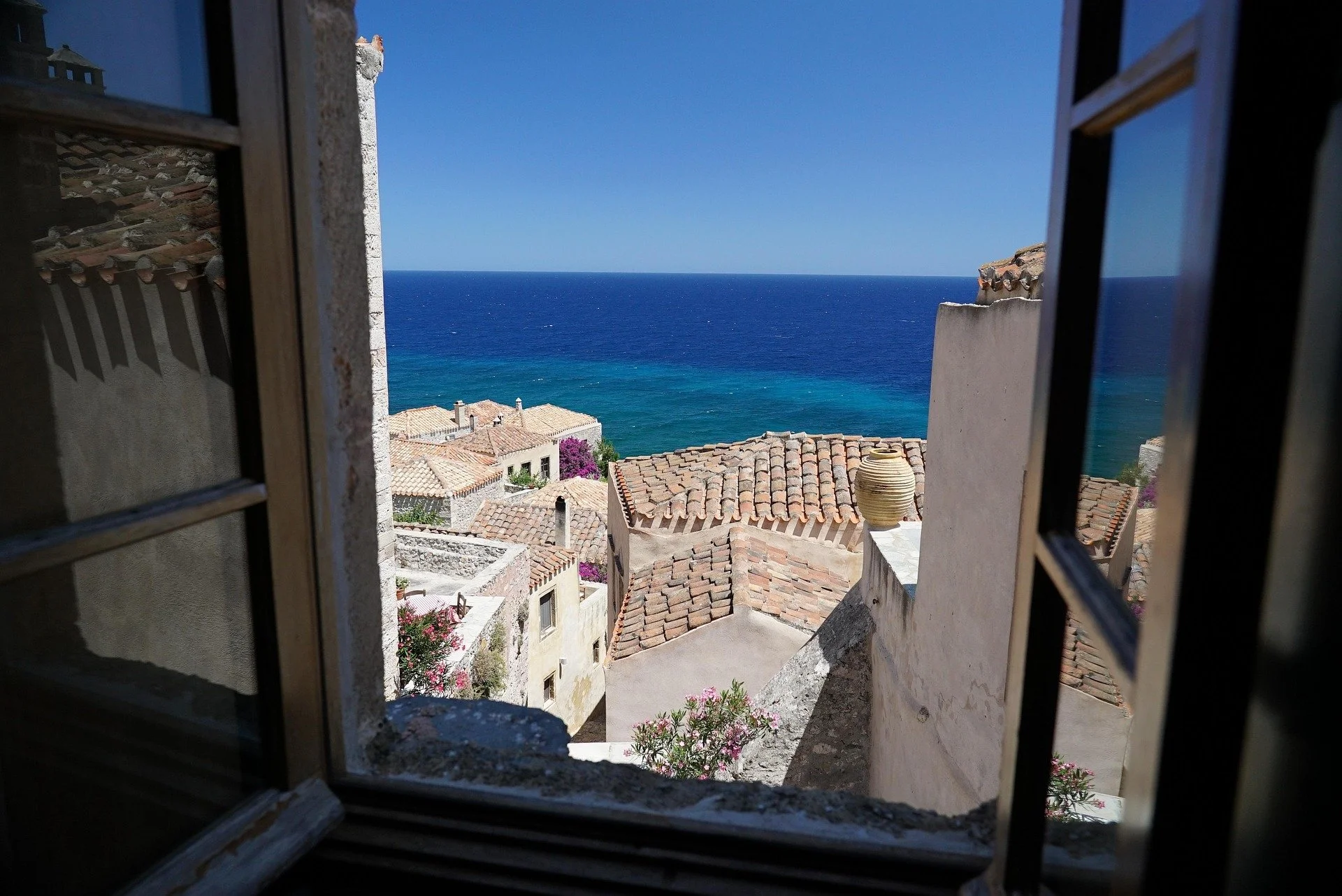 View from a traditional window inside Monemvasia overlooking the Aegean Sea