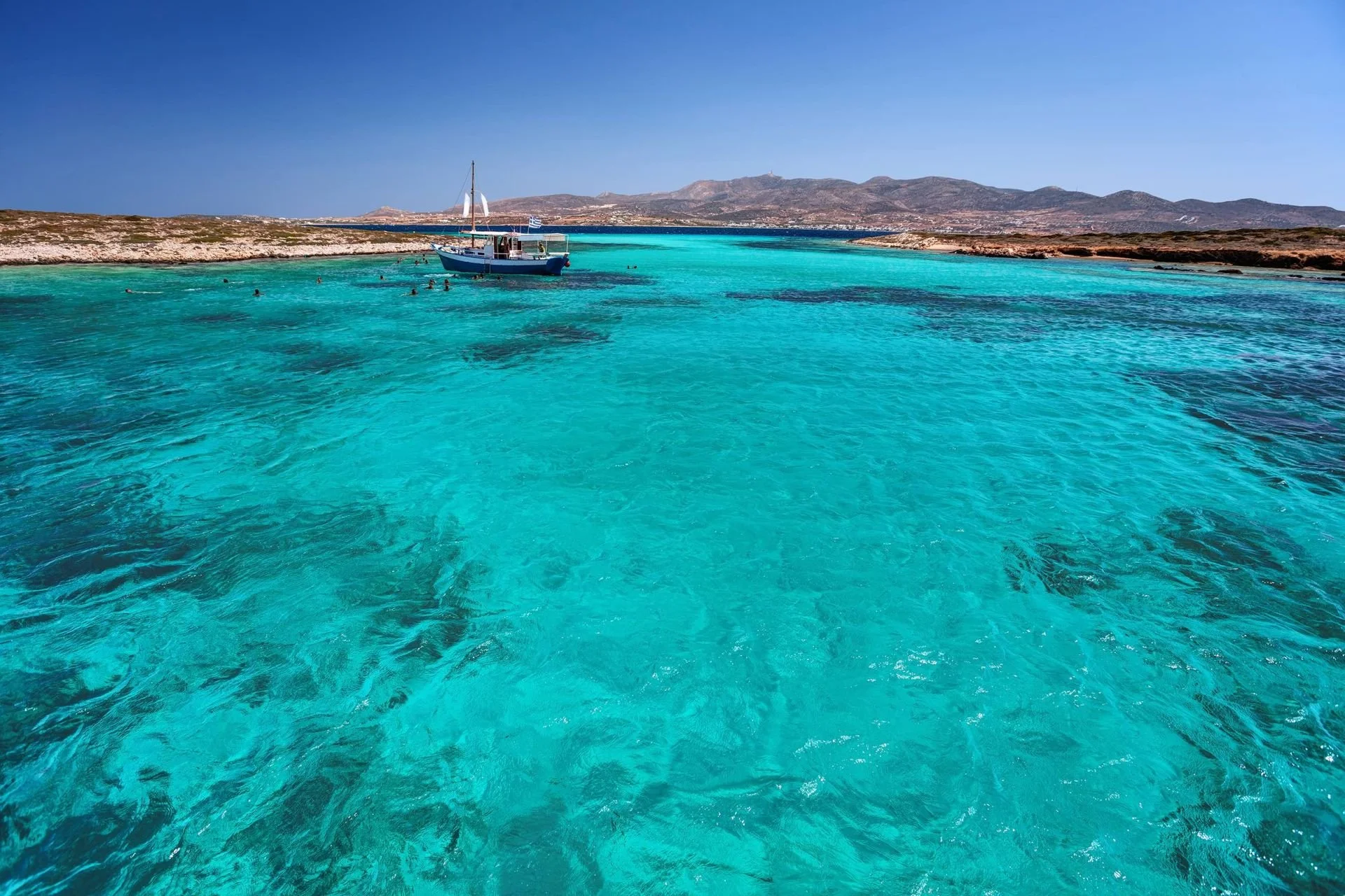 Turquoise waters and swim stop during a Paros sailing cruise