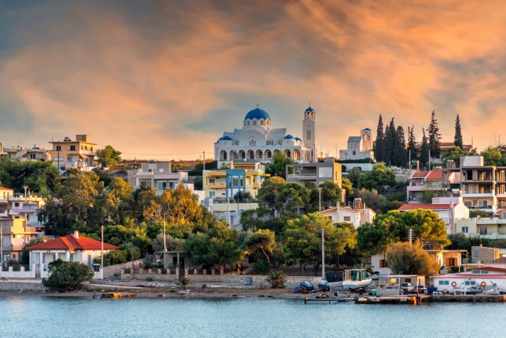 Sunset view of Salamina Island coastline and church near Athens Greece