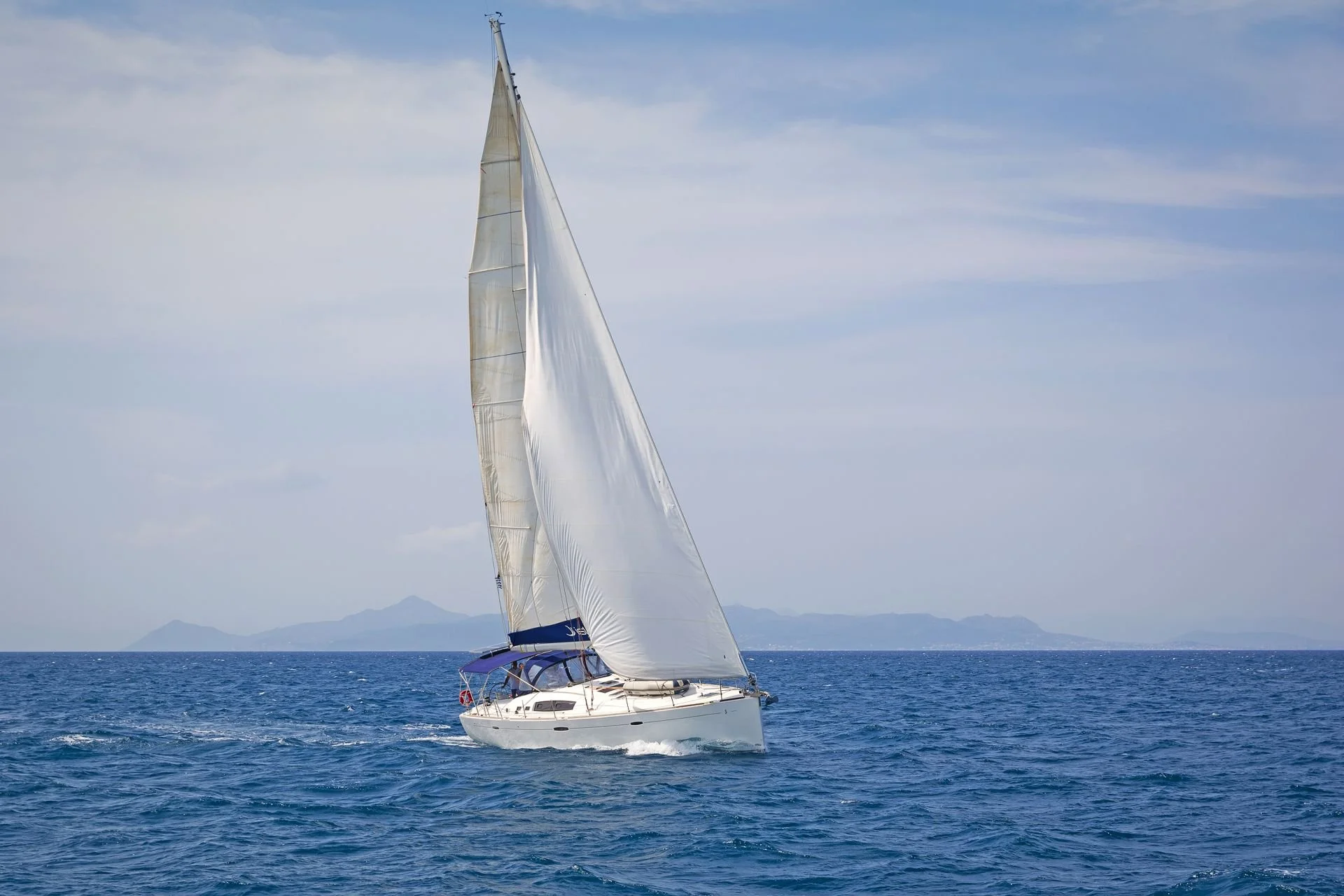 Sailing yacht cruising from Paros across the Aegean Sea