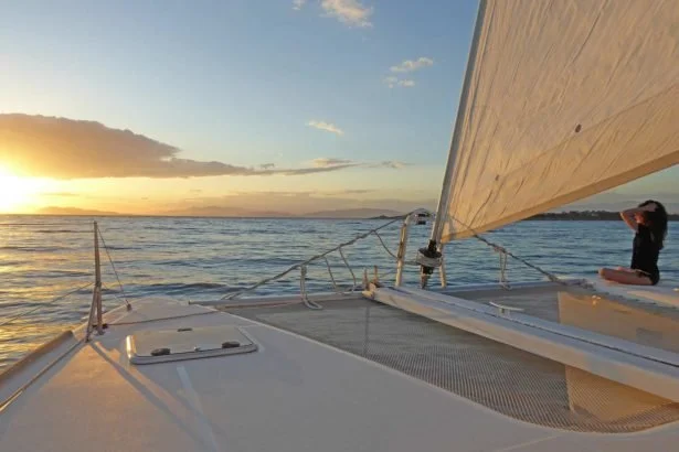 Relaxing on deck during a private catamaran cruise from Athens