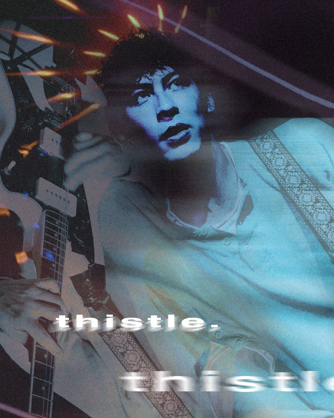 A person with short, curly hair appears in a projected image on a screen or wall. They are wearing a shirt and are holding an electric guitar. The image has a blue monochrome tone with some text overlaid that reads 'thistle'.