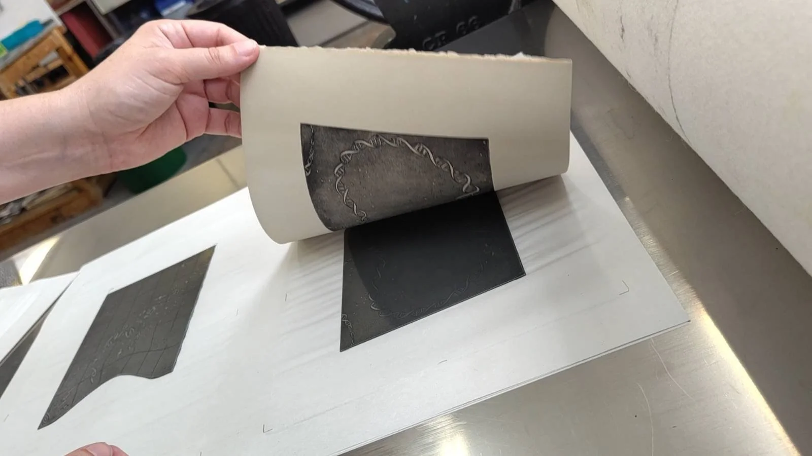 print being lifted from press