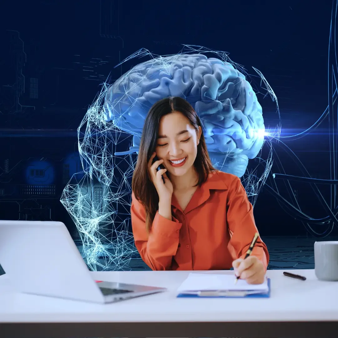 Professional working at a desk while talking on the phone and taking notes, with a digital AI brain and futuristic network graphics in the background, representing the integration of AI and offshoring in modern business operations.