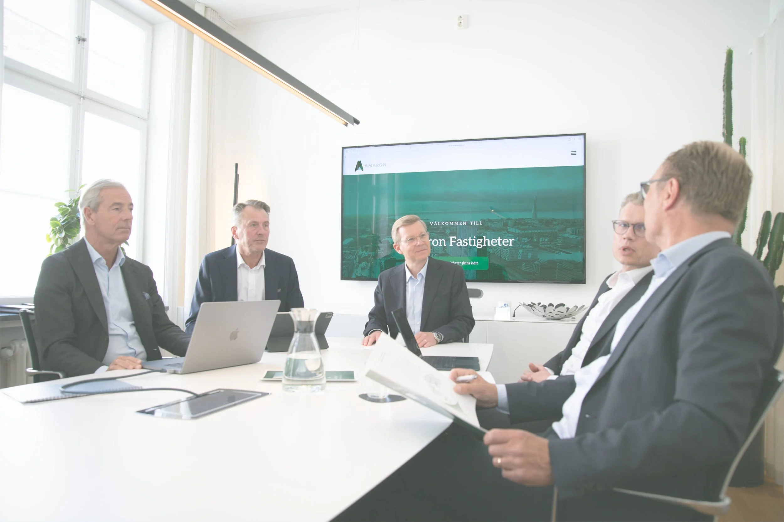Close-up of a modern building's exterior with angled balconies and glass railings.