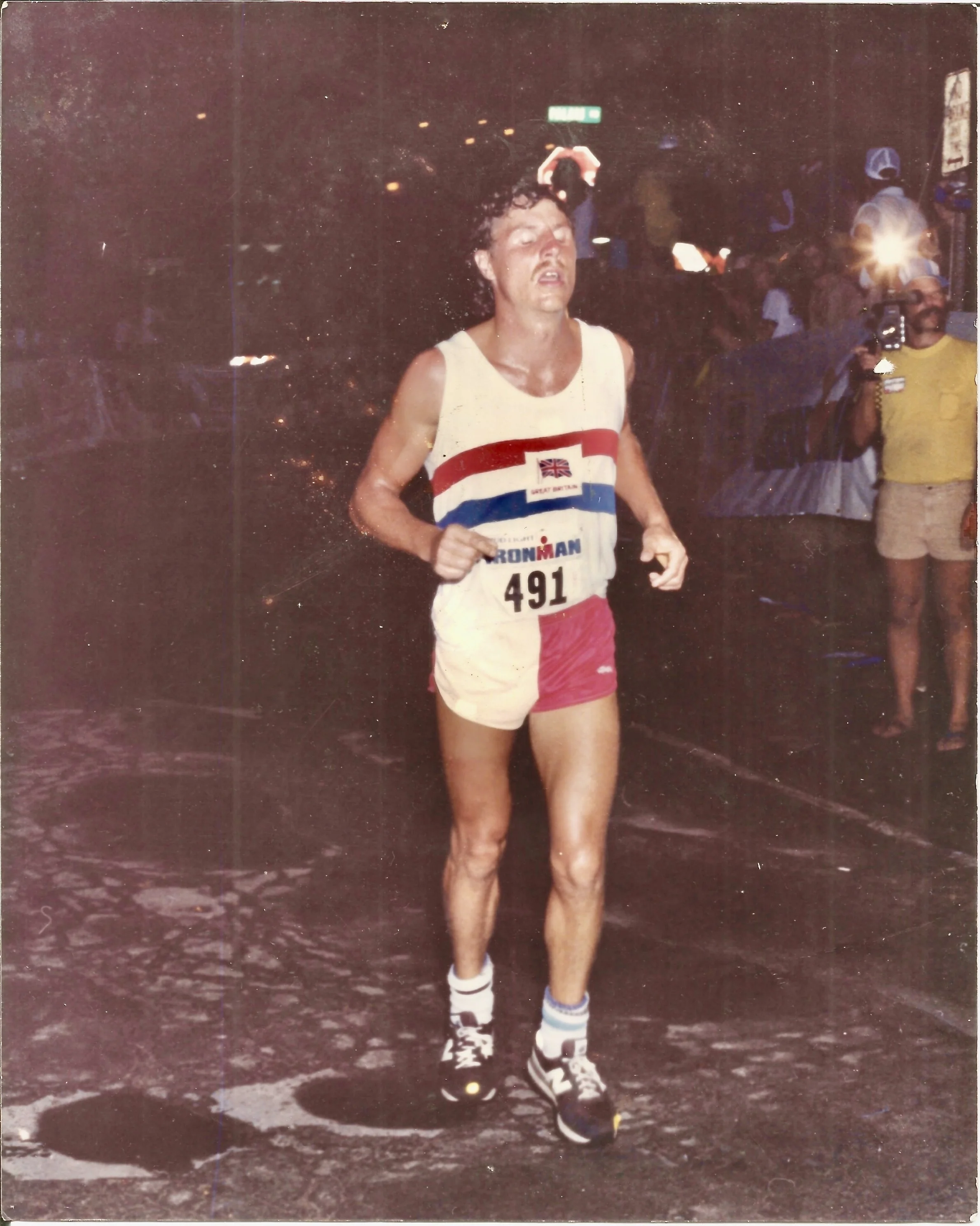Barry Jones MSc crossing the finish line at the Hawaii Ironman World Championship marathon.