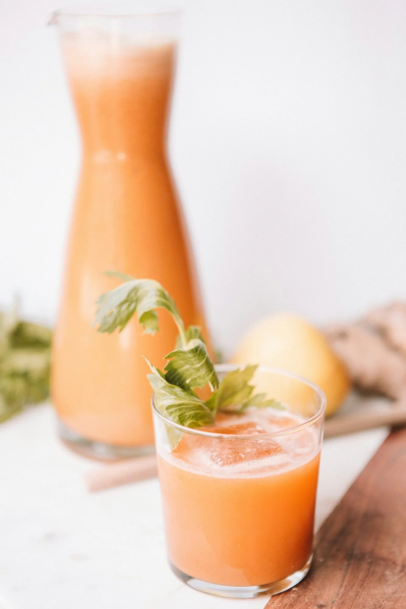 Glass of fresh juice with celery, representing holistic wellness and alcohol reduction program.