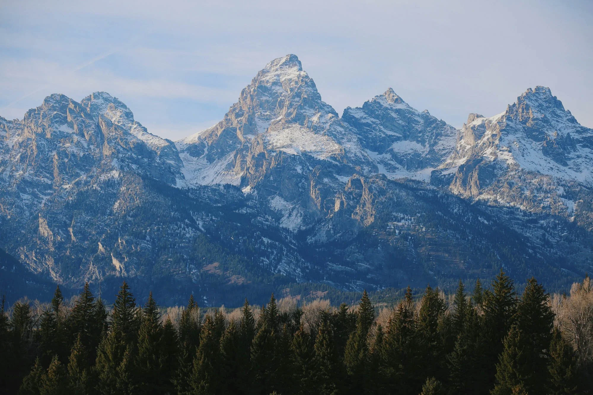 Snow-covered Teton Mountains symbolizing natural balance and holistic wellness.