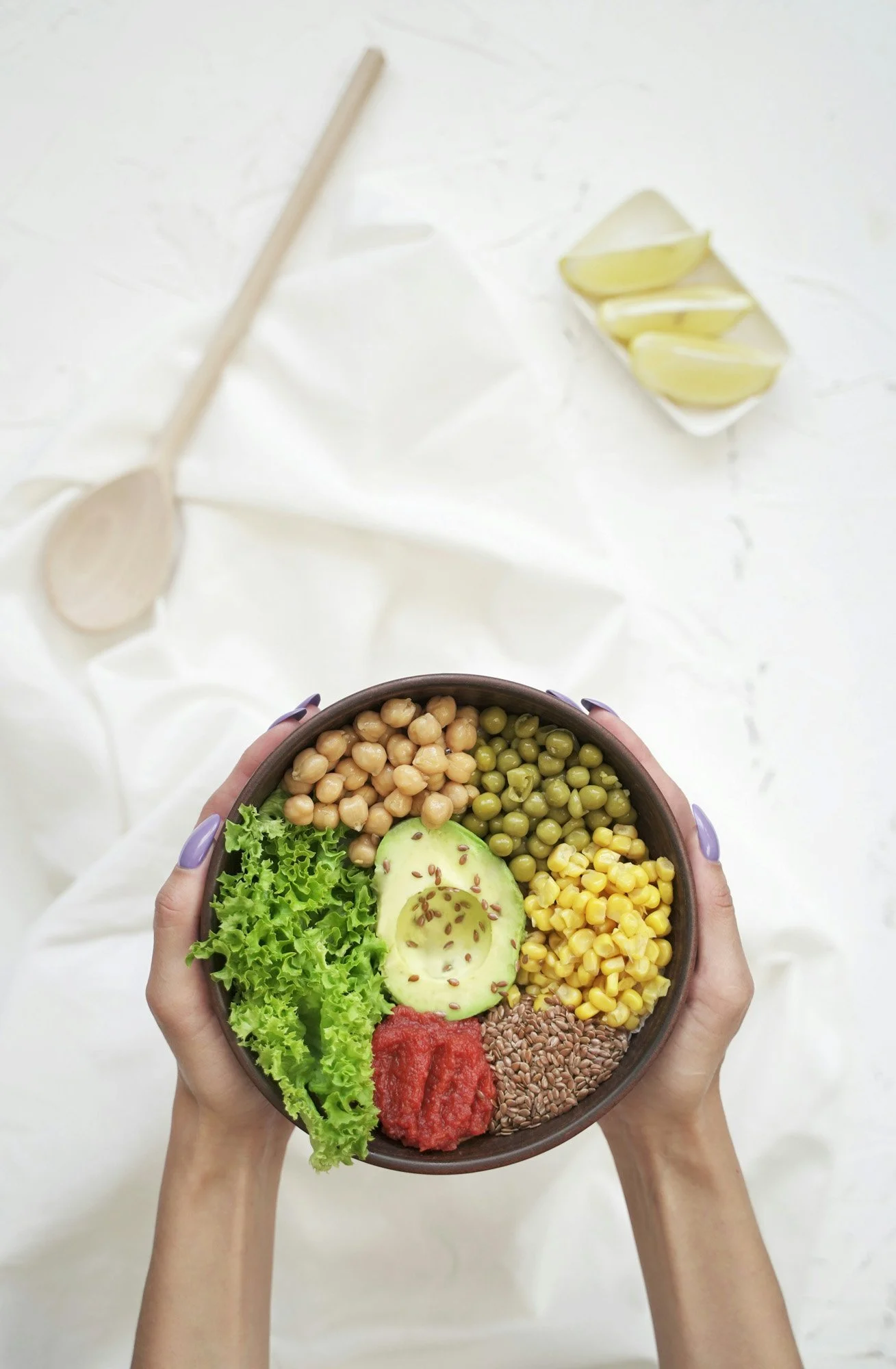 Colorful nutrient-rich bowl with avocado, greens, chickpeas, and seeds, representing hormonal detox and wellness.