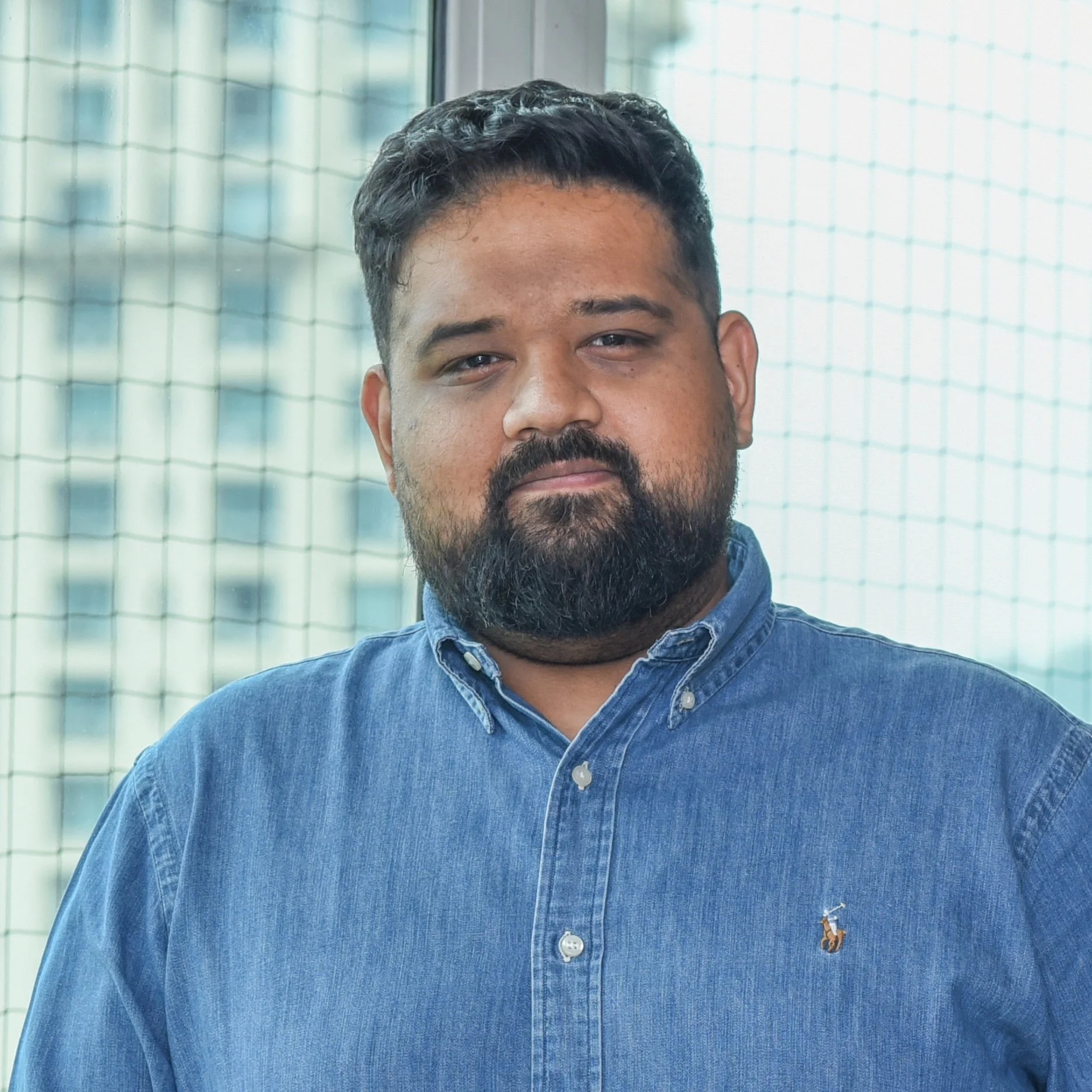 Portrait of a man with a beard and mustache, who is the founder of Milk Toast Solutions