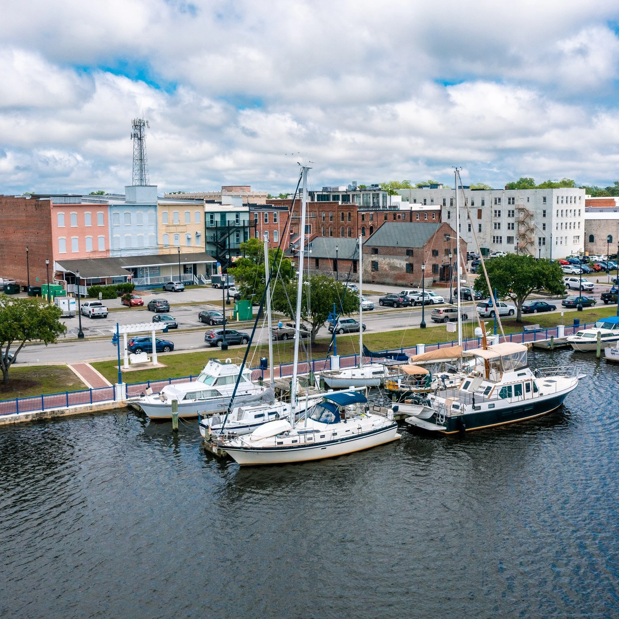 Aerial view of boats docked on the river beside downtown Washington, North Carolina.