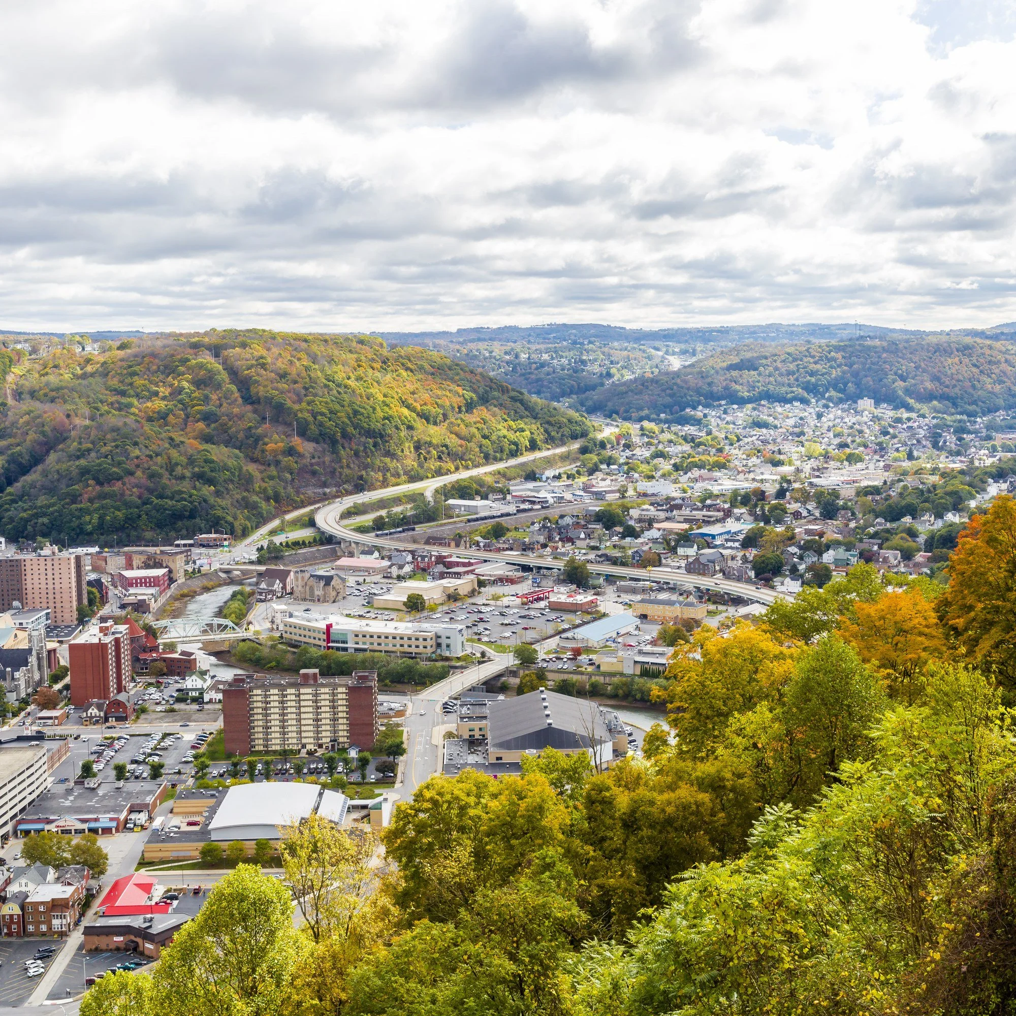 Johnstown, Pennsylvania, seen from the hills above, with the river valley and wooded ridges.