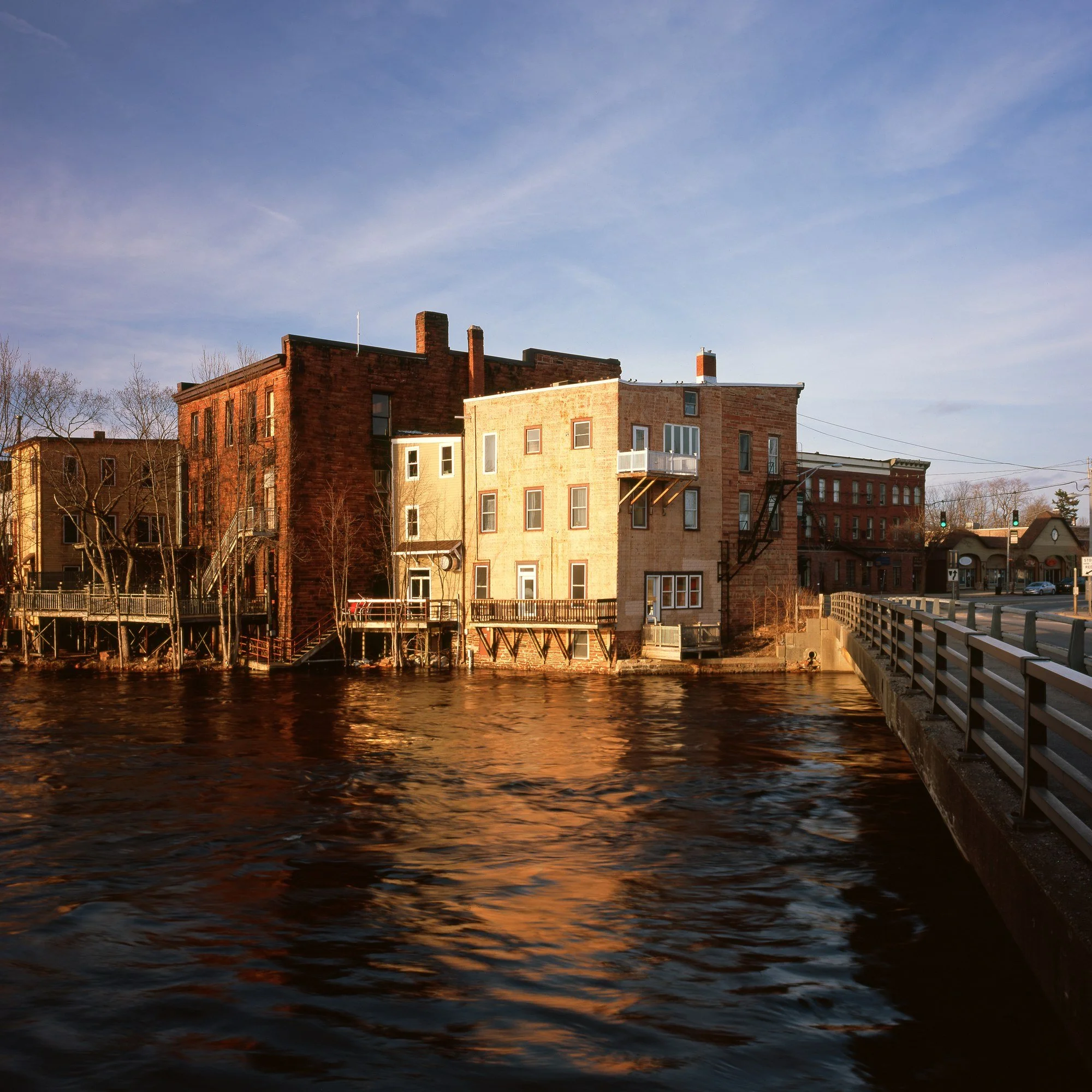 Historic buildings along the Raquette River in Potsdam, New York.