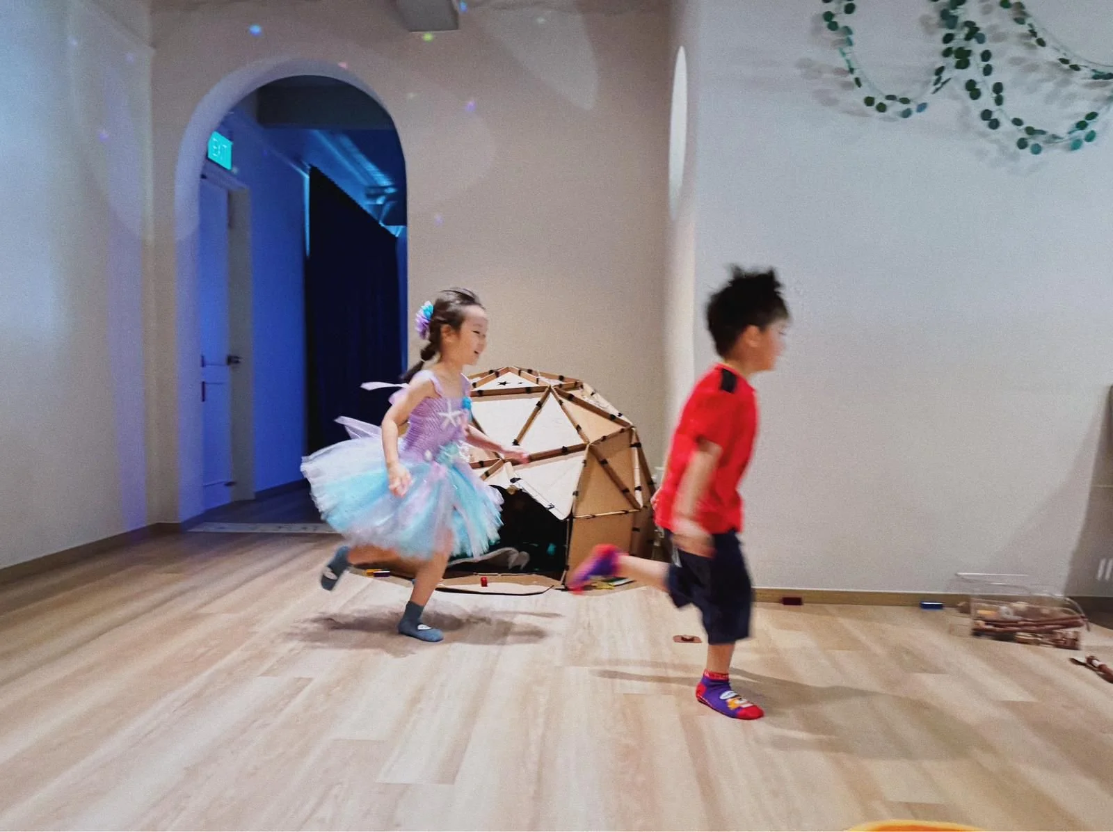 Children playing while celebrating a 1st and 5th birthday party at Riri’s Children Playloft, a calm indoor kids party venue in Singapore.