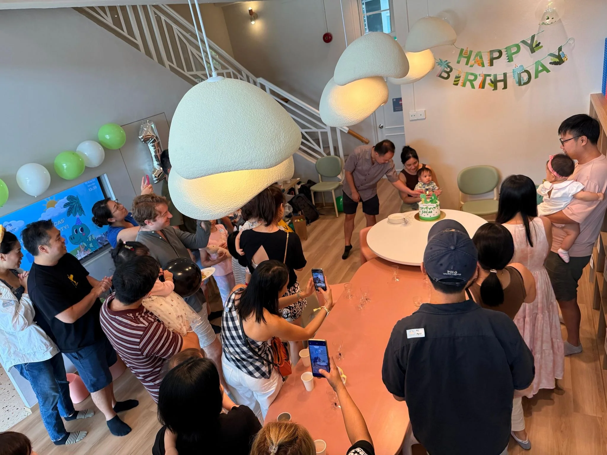 Cake cutting ceremony at a 1st birthday party held at Riri's Children Playloft along Upper Thomson Road, Bishan. 