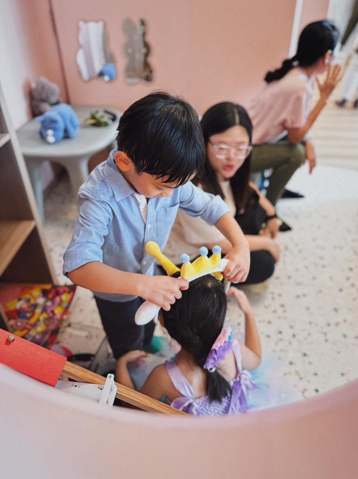Children playing while celebrating a 1st and 5th birthday party at Riri’s Children Playloft, a calm indoor kids party venue in Singapore.