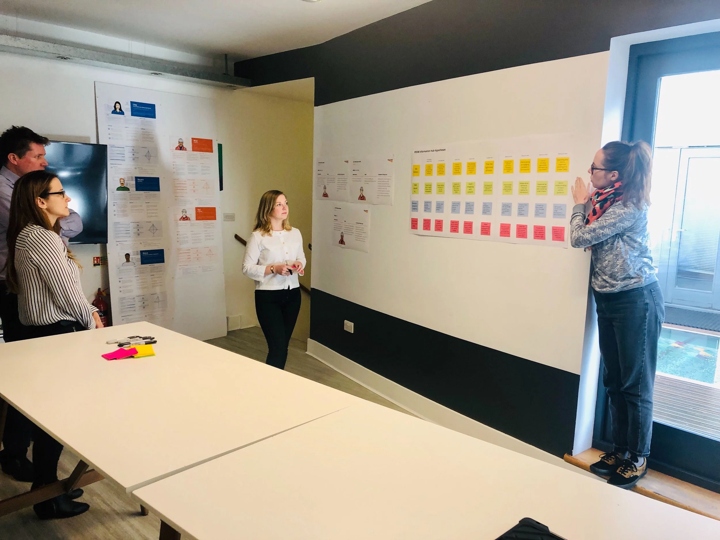 Gemma presenting to stakeholders during an immersion workshop