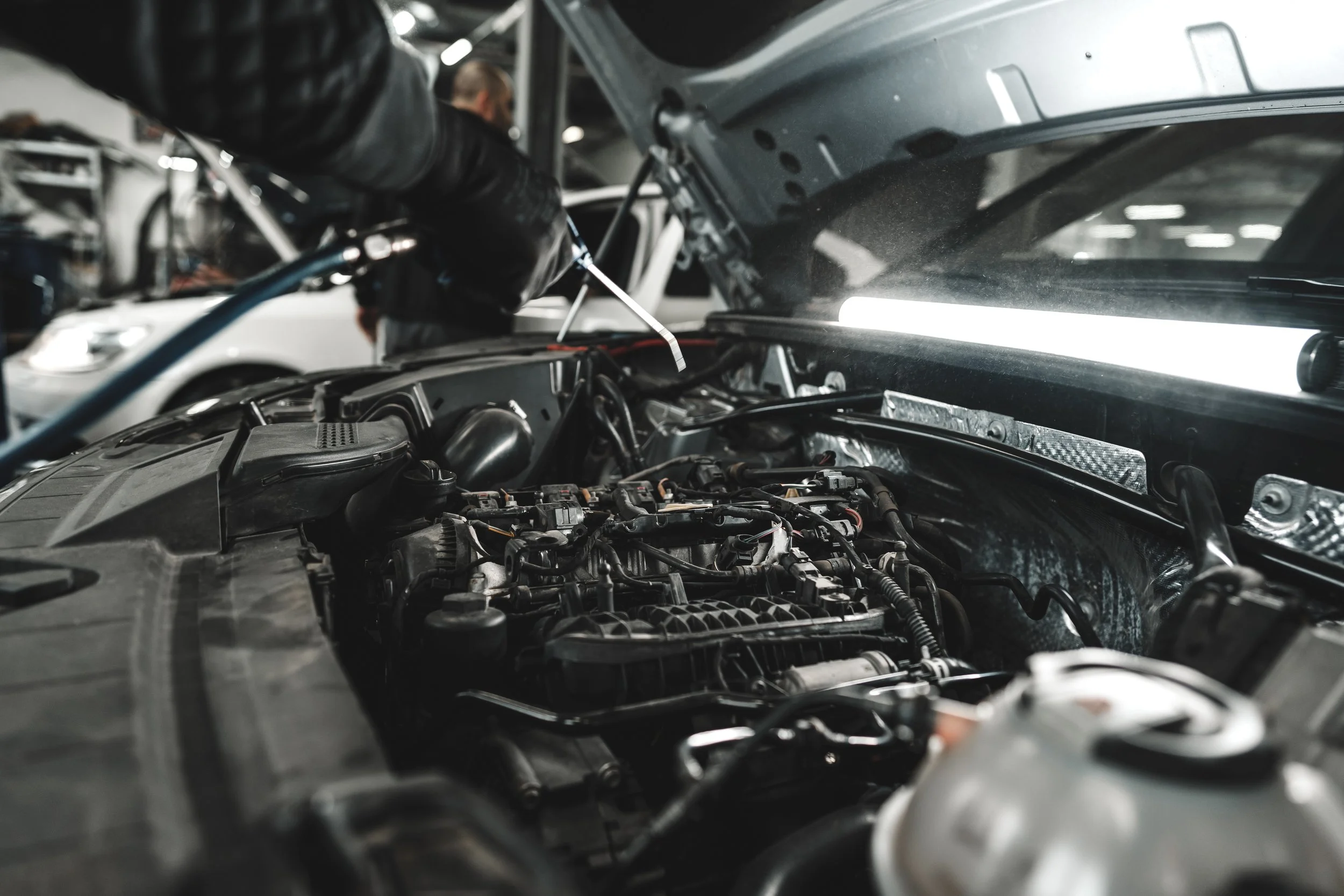 close-up-of-mechanic-s-hands-repairing-car-engine-2025-02-25-21-42-33-utc.jpg