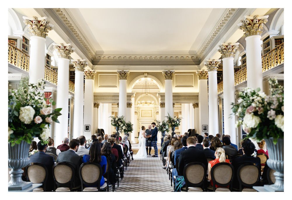 Wedding ceremony at the Lower Library of The Signet Library, Parliament Square, Edinburgh. Showcasing floral design by Planet Flowers.