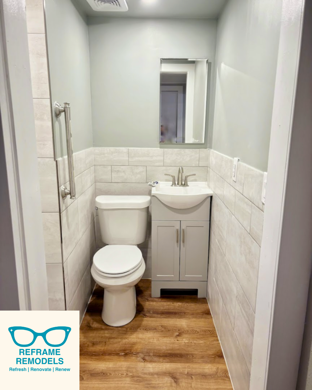 Bathroom remodel with curbless shower and safety grab bars