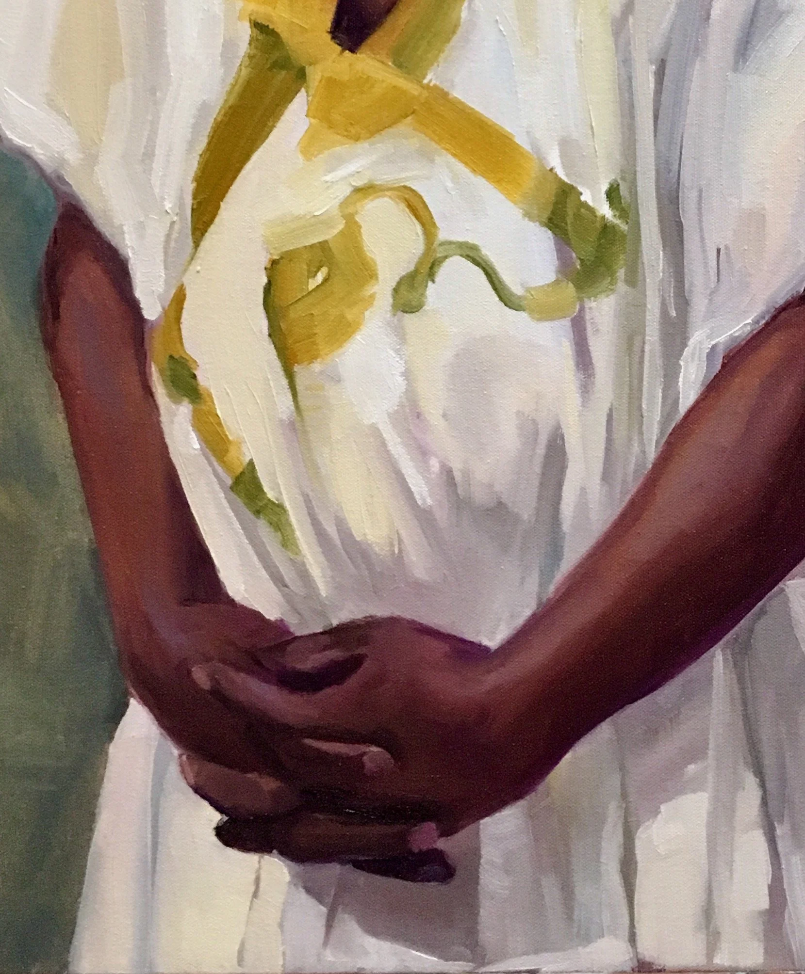 Part of a portrait (hands) of a man in a white kaftan (Senegal) with green and yellow details .