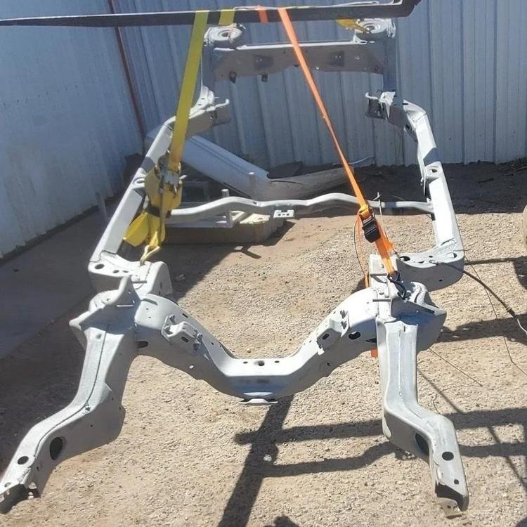 A 1959 Chevelle car frame chassis was media blasted to remove old paint and rust for new prime and paint