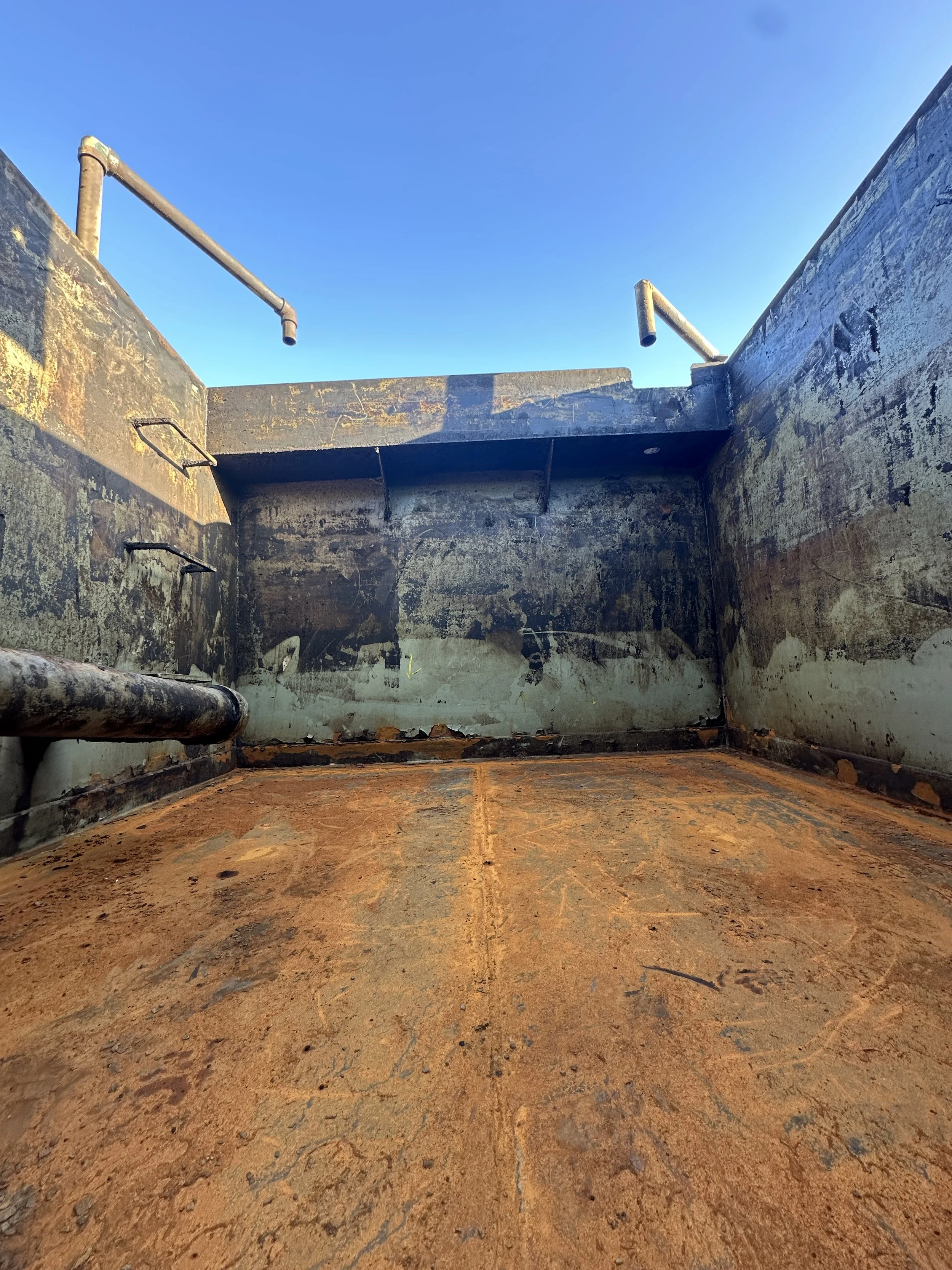 Oil Field Water Retention Tank before blasting