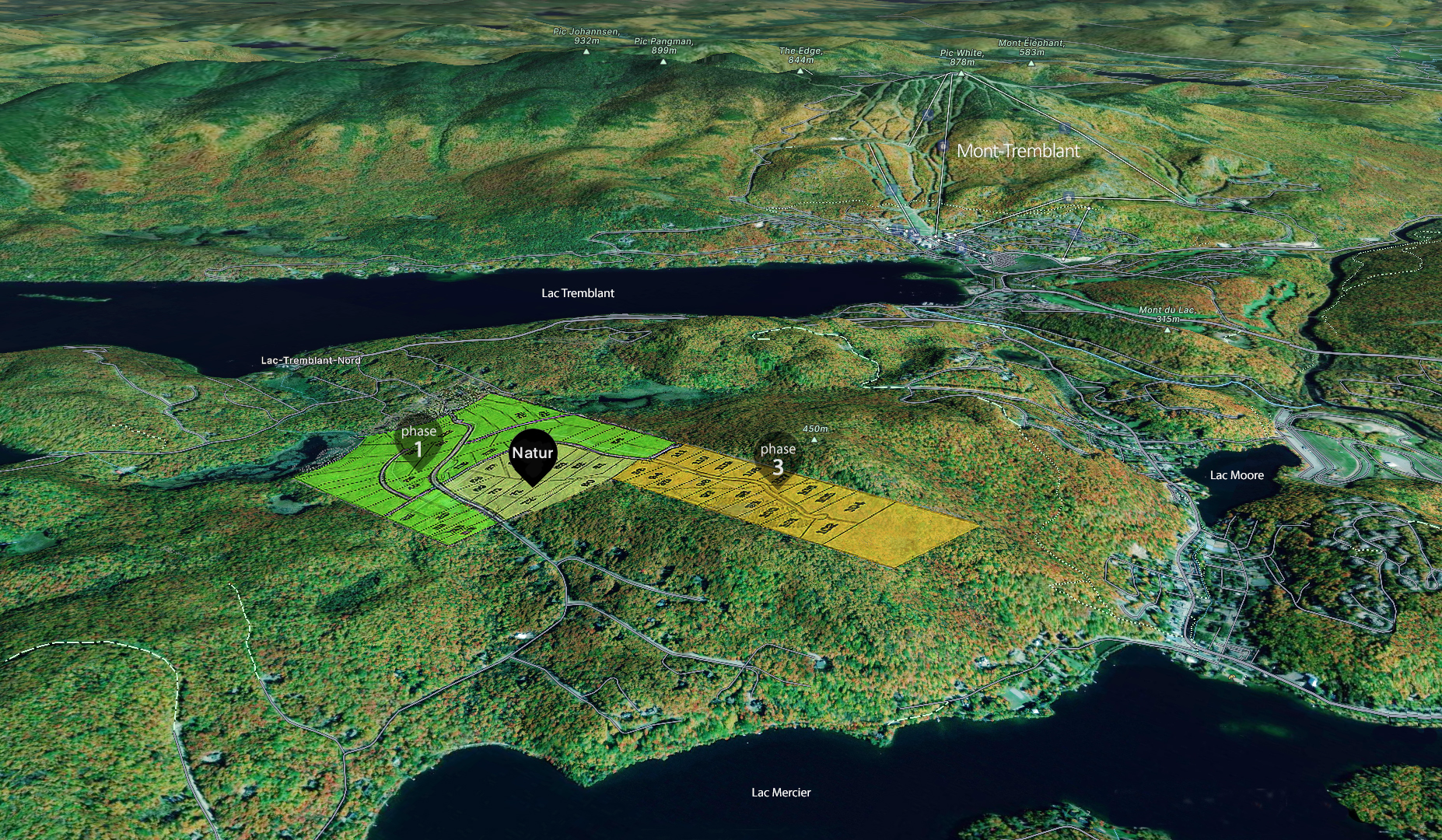 Aerial map of the Tremblant area showing lakes, forests, and marked zones labeled 'phase 1' and 'phase 3' with natural features and topography indicated.