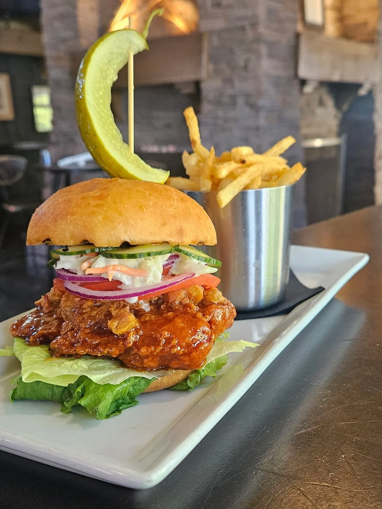 This weekends special NASHVILLE &ldquo;FLYING PIG&rdquo; SANDWICH 🔥 🐷 

Crispy Chicken, Nashville Hot sauce, Smoky BBQ pulled pork, coleslaw, house pickled cucumbers, Lettuce, Tomato, onion, Served on a Brioche Bun, with Shoestring Fries

28$

This