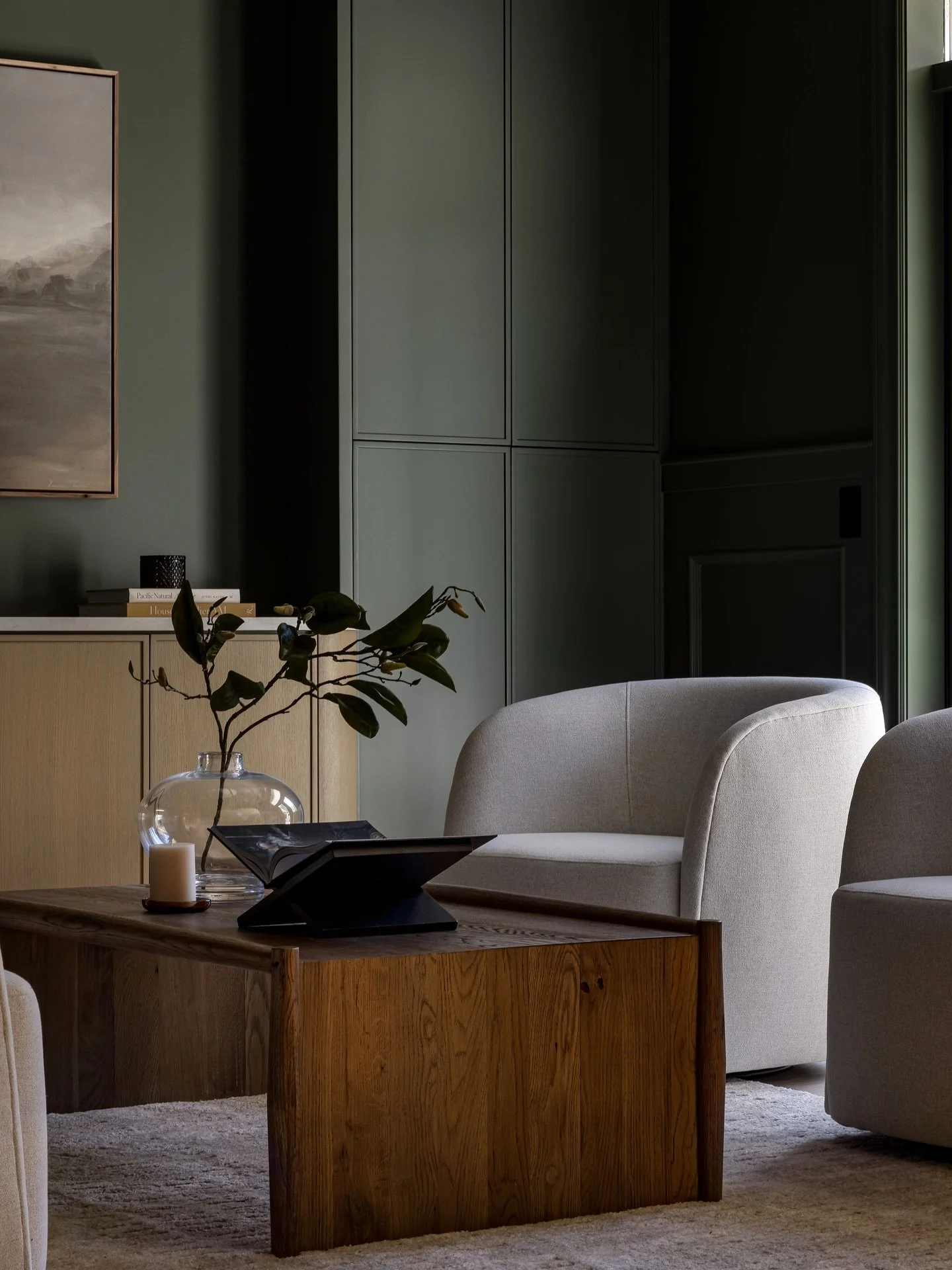 This parlor room is a perfect showcase of color drenching - wrapped in Sherwin Williams&rsquo; Pewter Green with custom cabinetry painted to match for a seamless, integrated look. A space made for lingering conversations and the perfect cocktail in h