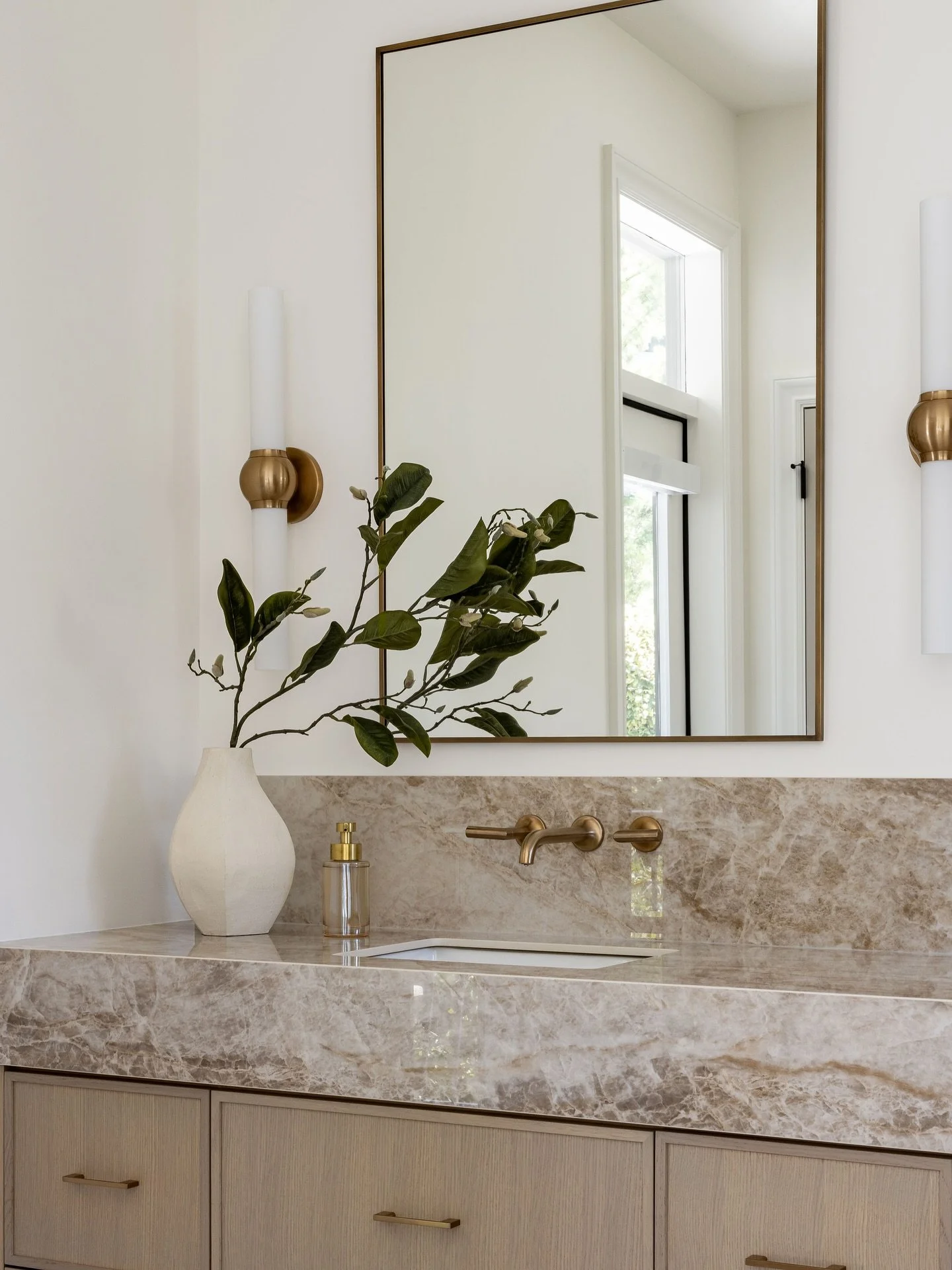 Welcome to the primary ensuite at &lsquo;The Wabi Project&rsquo;! We chose Dekton&rsquo;s Taga for its striking movement and natural stone look. Paired with warm brass accents, sleek cabinetry, and sculptural details, this vanity is pure perfection! 
