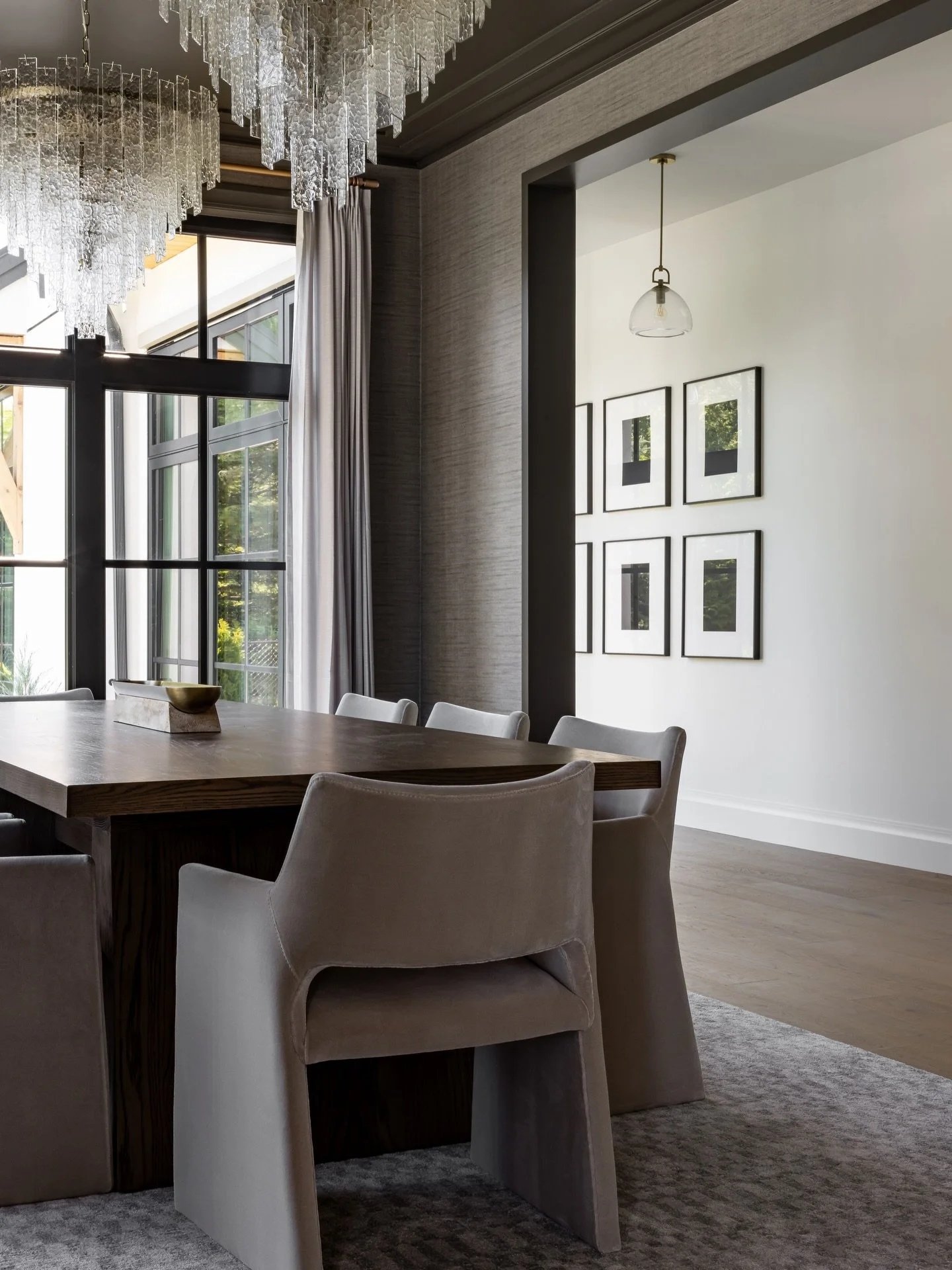 Dining rooms are the perfect place to set a mood, and this one does just that! The dark ceiling creates an inviting, intimate vibe and lets those double chandeliers really steal the show. The whole space feels refined and ready for the perfect dining