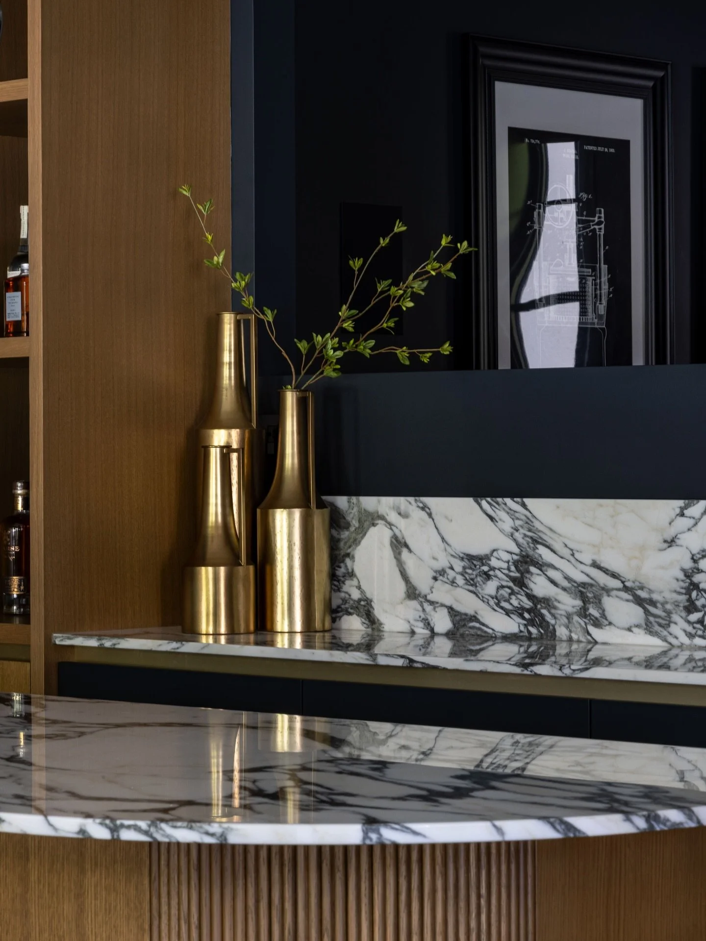 Welcome to our Cedar Grove rec room and bar! Scroll through and you&rsquo;ll spot one of our favourite details, an authentic vintage poster from an old bar in France. We also love the statement that the veined marble countertops make!

Interior Desig