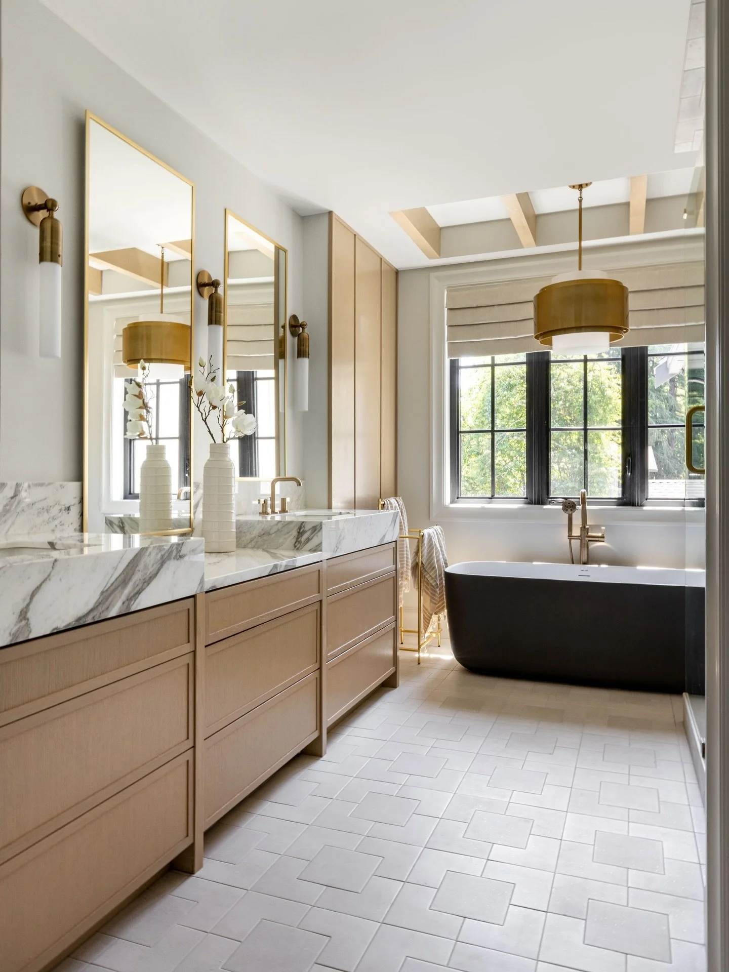 Tile layout was everything here! Imported from Spain, Wow Tile flooring was laid out with intention so every line aligns, right down to the shower niche, which was designed and drawn to fit the tile perfectly. Thoughtful planning like this makes all 