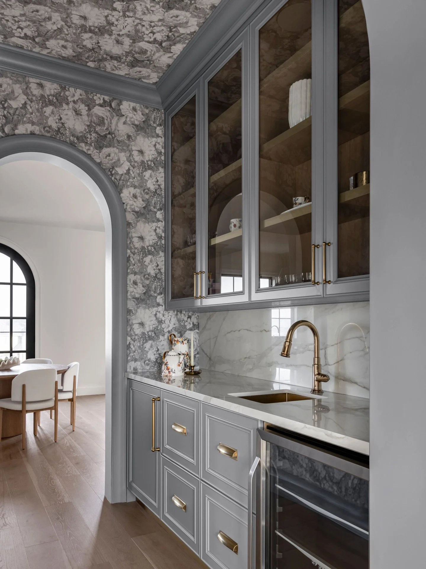 Nothing makes us happier than when a client says yes to colour! 🩵🩵

This beverage bar leans into French provincial charm, with vintage floral wallpaper setting the tone. A soft steel blue, pulled straight from the wallpaper&rsquo;s undertones, adds