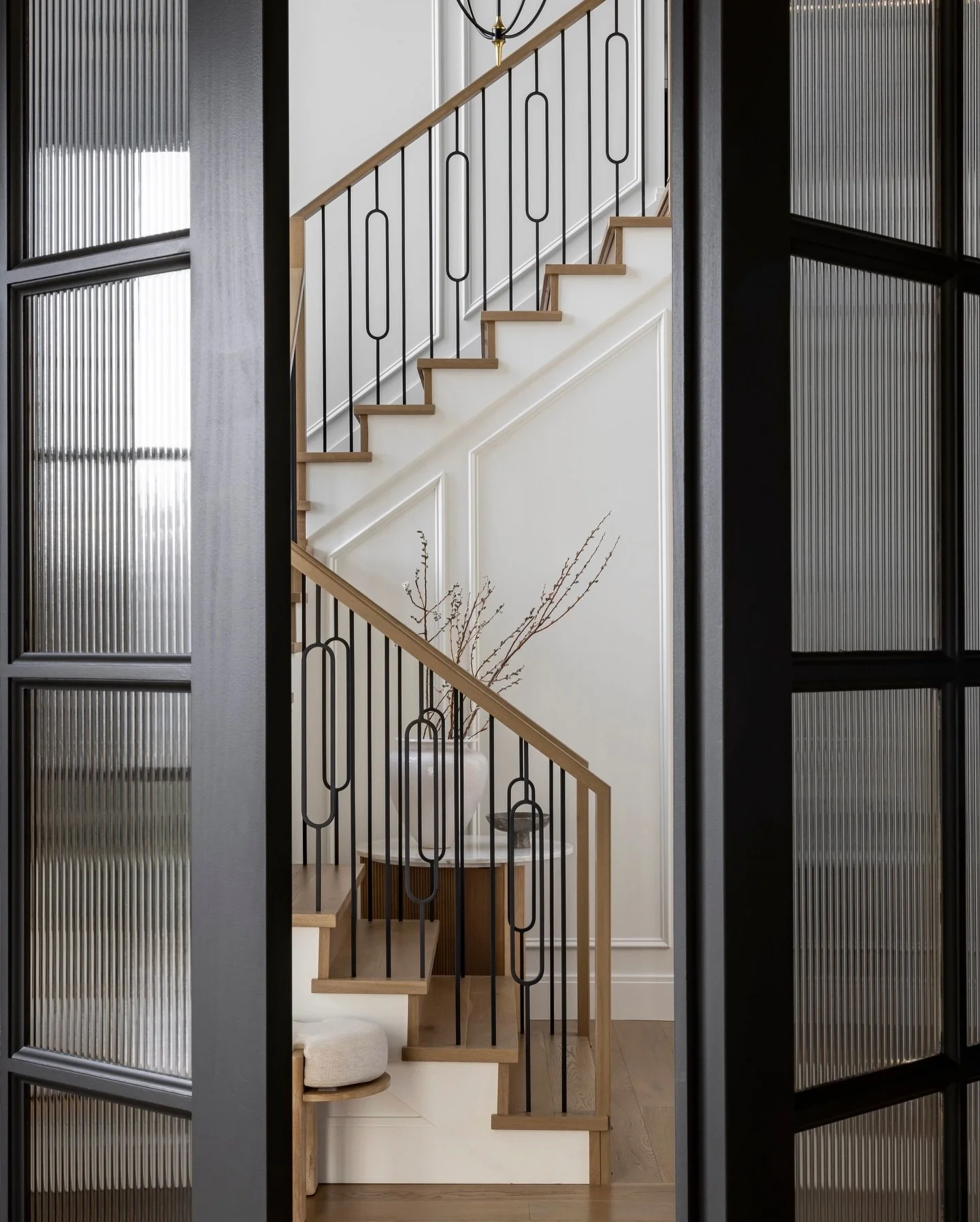 If first impressions matter, the entry way at our &ldquo;Herringbone House&rdquo; project is sure making itself known!

The soft oak tones, gorgeous detailed railing, and oversized windows create such a beautiful first impression the moment you step 