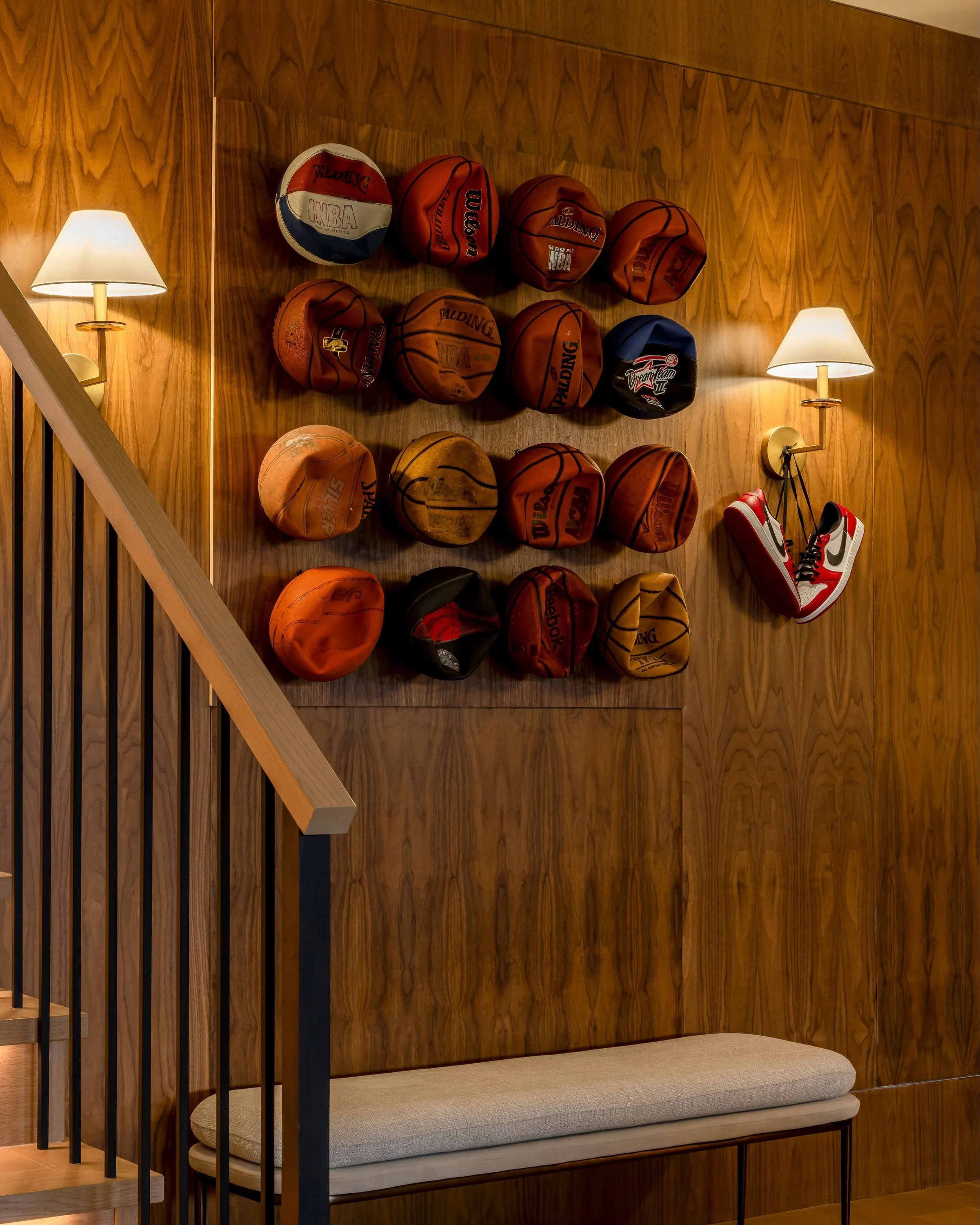 Every good home bar needs a statement piece, and this deflated basketball feature wall does exactly that. It brings so much personality to the space while doubling as the perfect conversation starter. We&rsquo;ll never get tired of designing home bar
