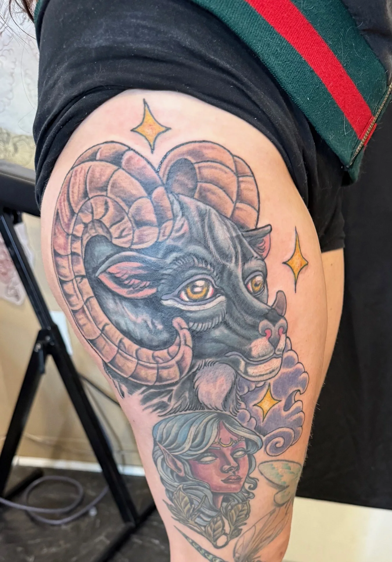 Black big horned sheep drawn on freehand with accompanying night elf from world of warcraft tattoo.