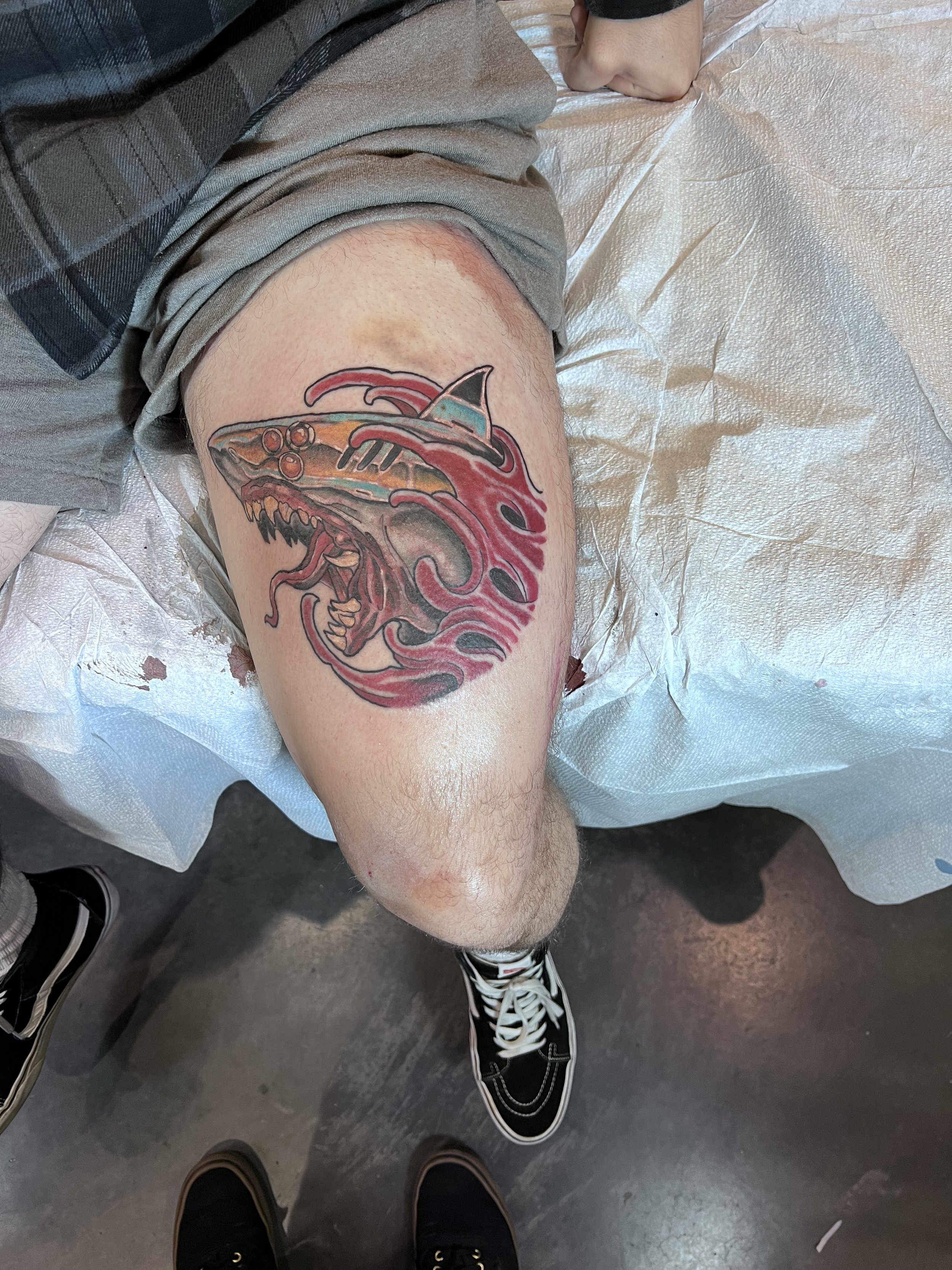 A neo trad cyber shark swimming a sea of blood.  This tattoo was made at The Hampton Roads Tattoo Festival.  This bright and bold tattoo is designed to stand the test of time.  This tattoo was made by award winning tattoo artist.  Killianpbtattoos.